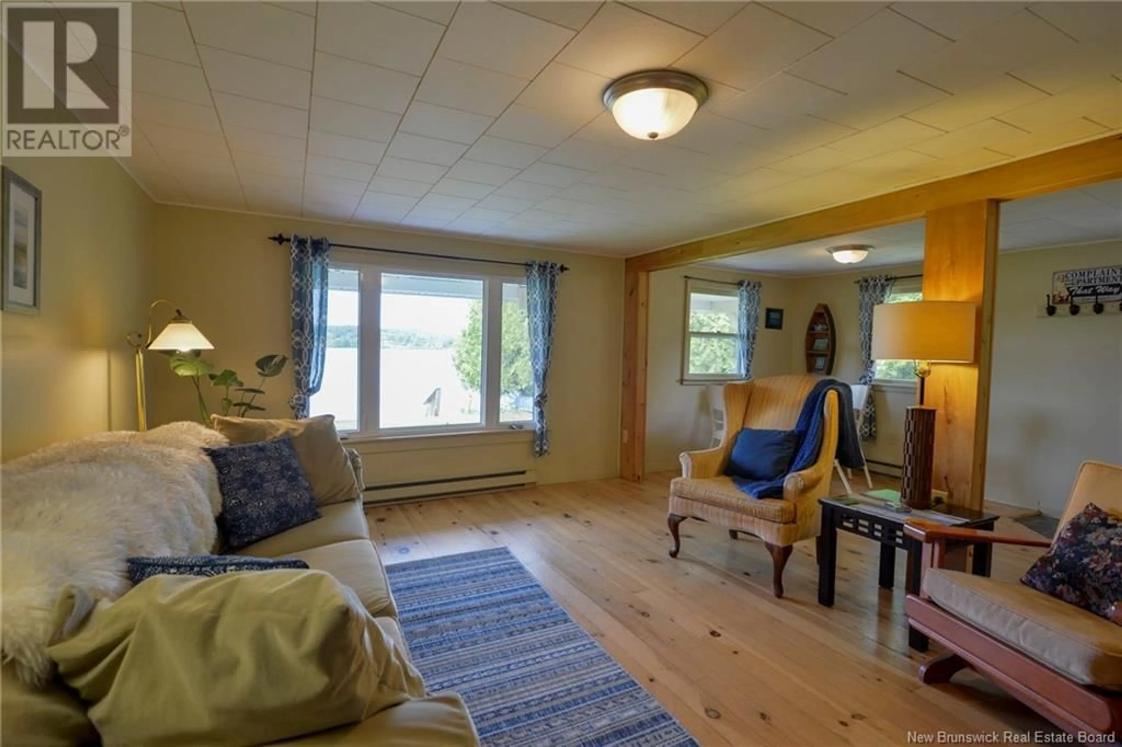 Living room with furniture, wood/laminate floor for 128 LAKEFIELD ROAD, Cassidy Lake New Brunswick E4E5Y9
