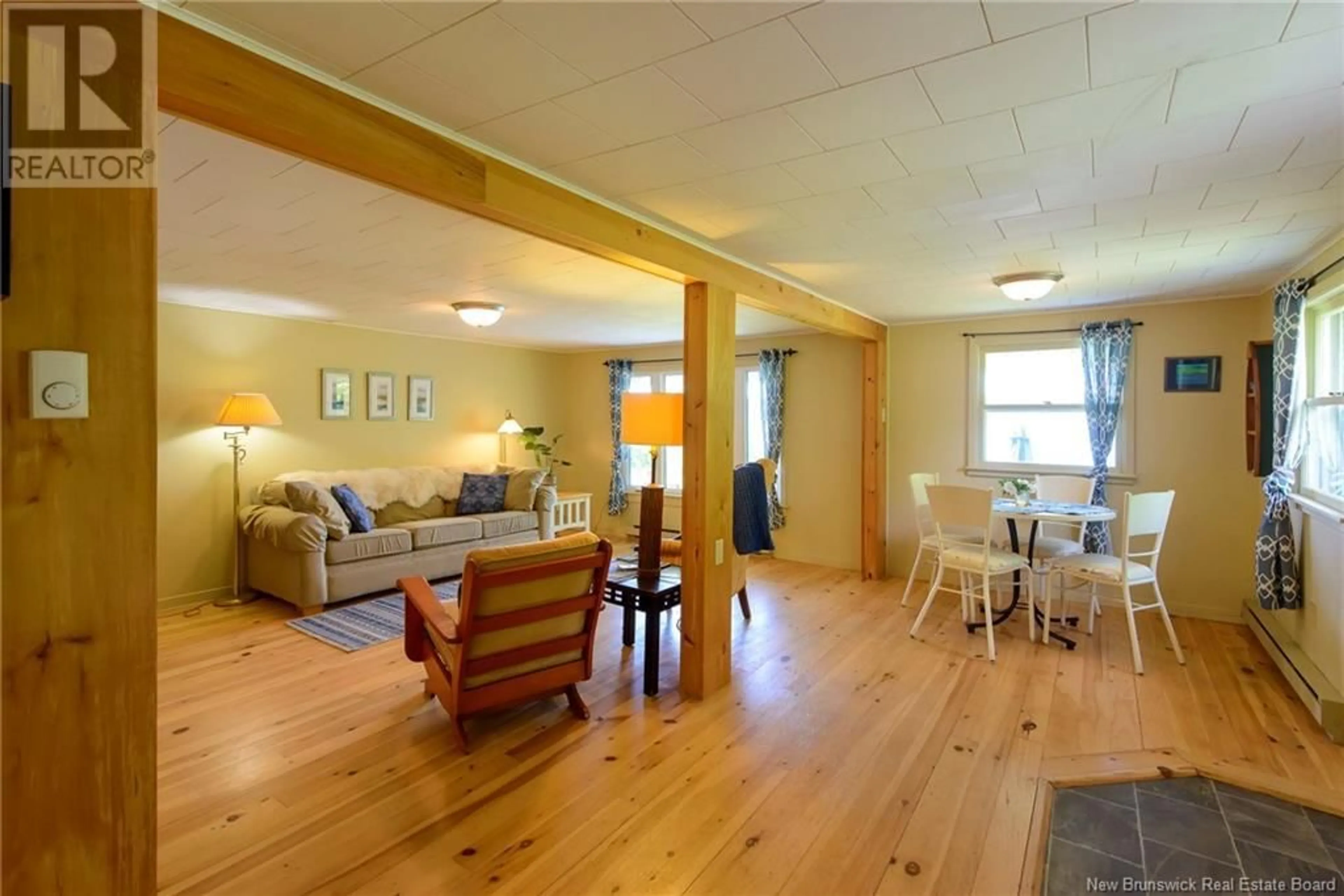 Living room with furniture, wood/laminate floor for 128 LAKEFIELD ROAD, Cassidy Lake New Brunswick E4E5Y9