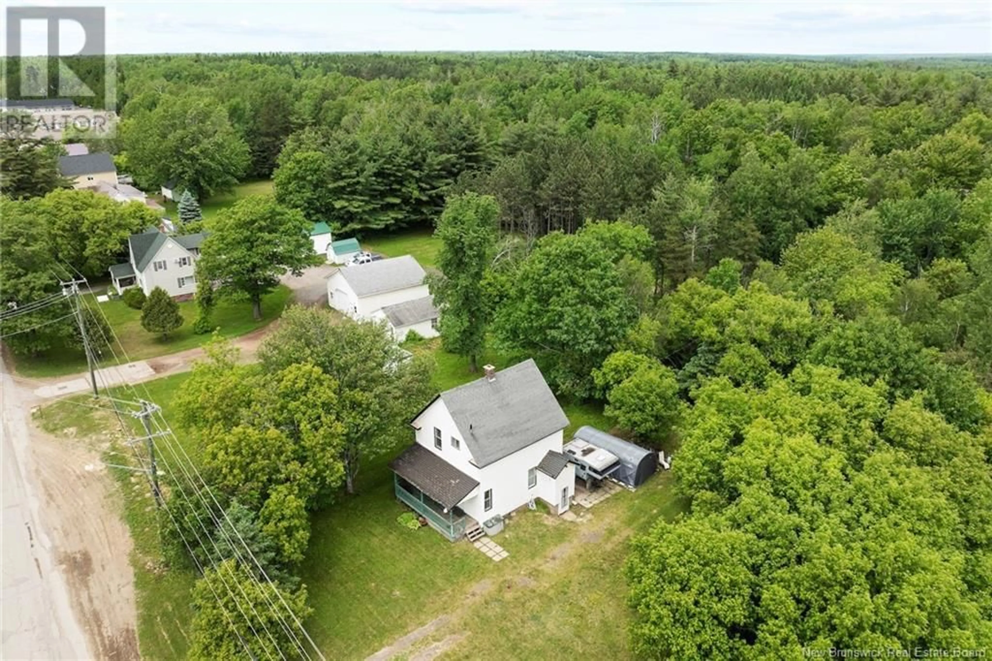 A pic from outside/outdoor area/front of a property/back of a property/a pic from drone, water/lake/river/ocean view for 80 BRIDGE STREET, Chipman New Brunswick E4A1R9