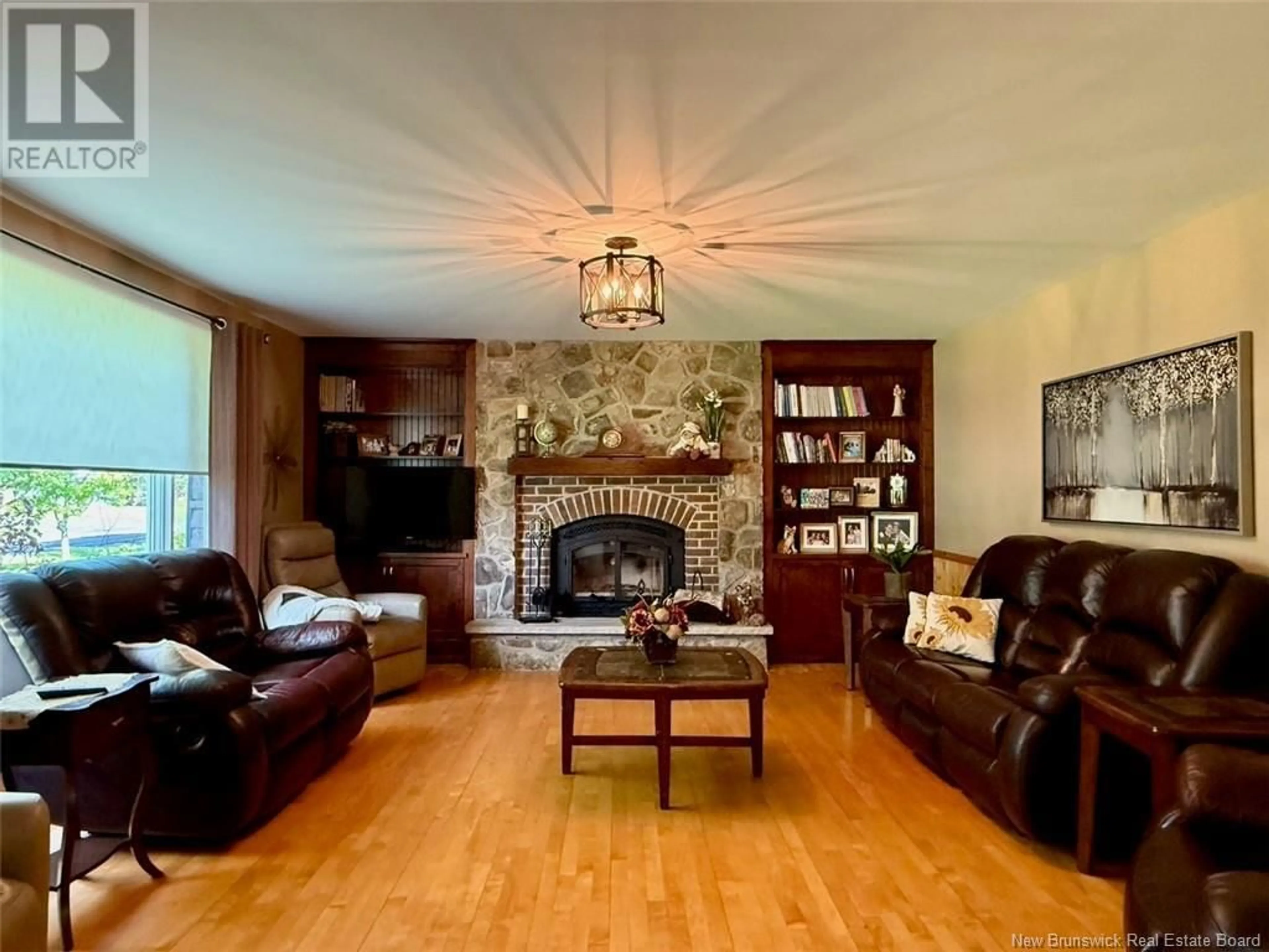 Living room with furniture, wood/laminate floor for 25 ARSENEAULT STREET, Balmoral New Brunswick E8E1A1