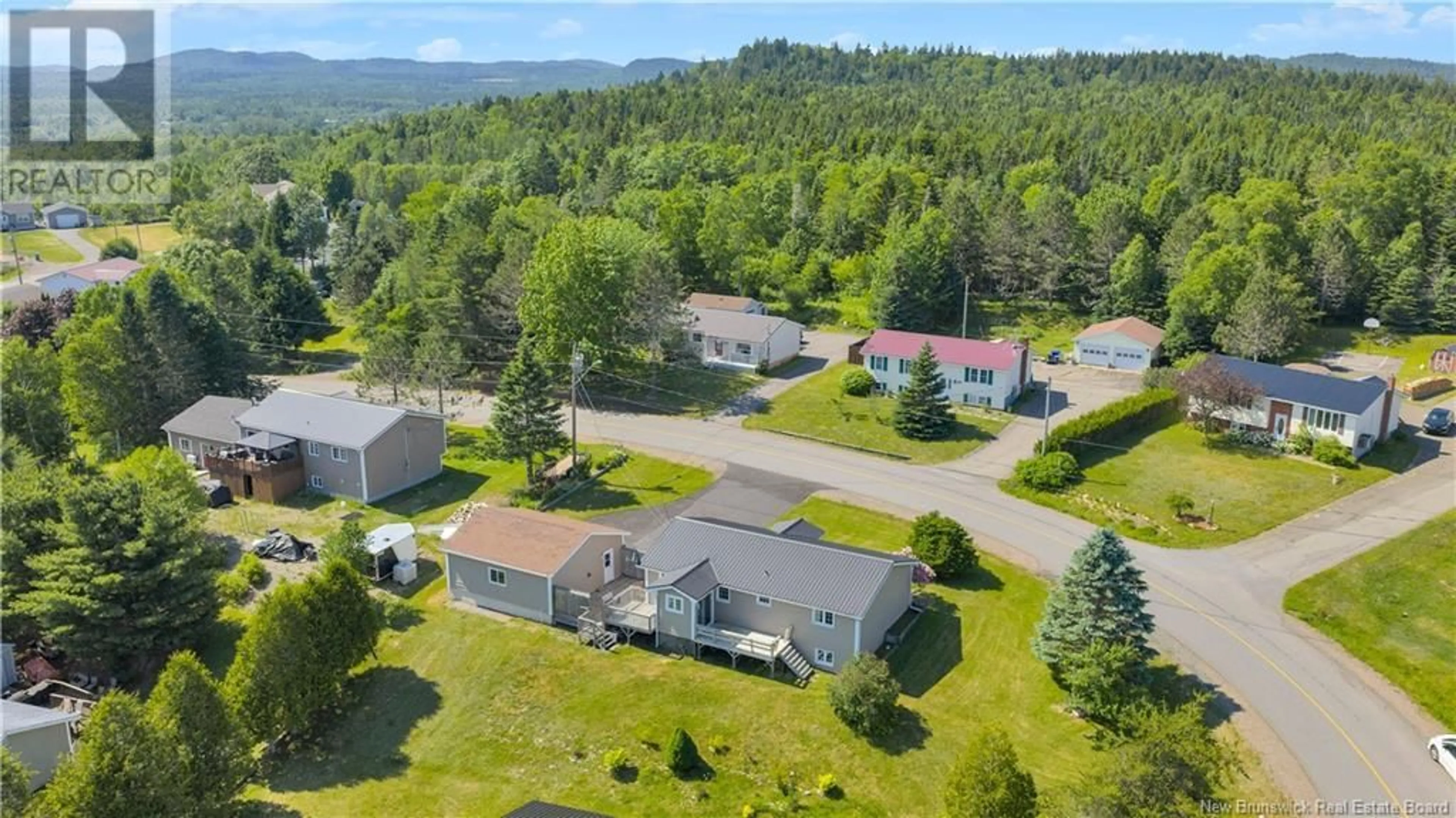 A pic from outside/outdoor area/front of a property/back of a property/a pic from drone, unknown for 15 ARMSTRONG CRESCENT, St George New Brunswick E5C1A1