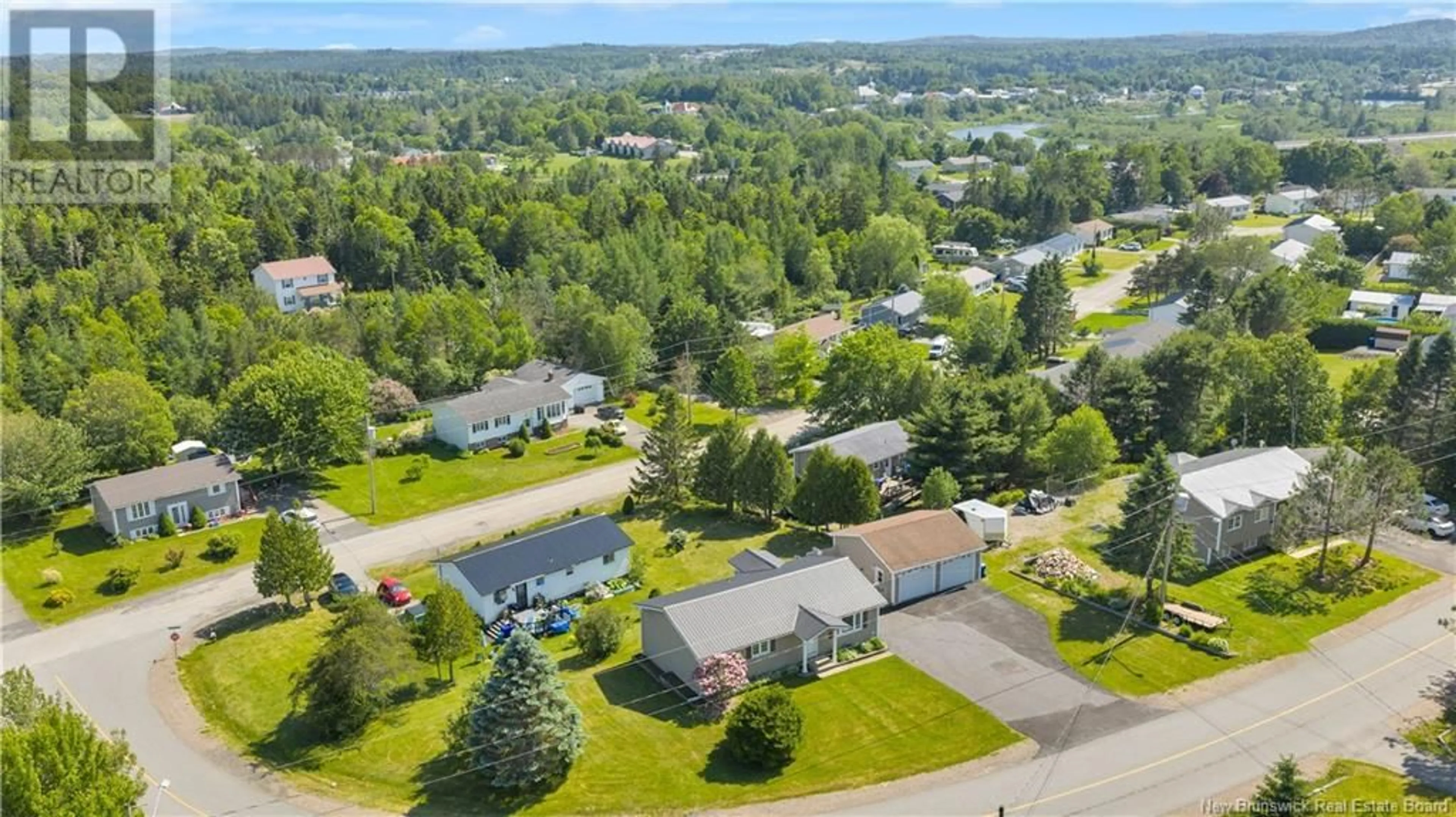 A pic from outside/outdoor area/front of a property/back of a property/a pic from drone, unknown for 15 ARMSTRONG CRESCENT, St George New Brunswick E5C1A1