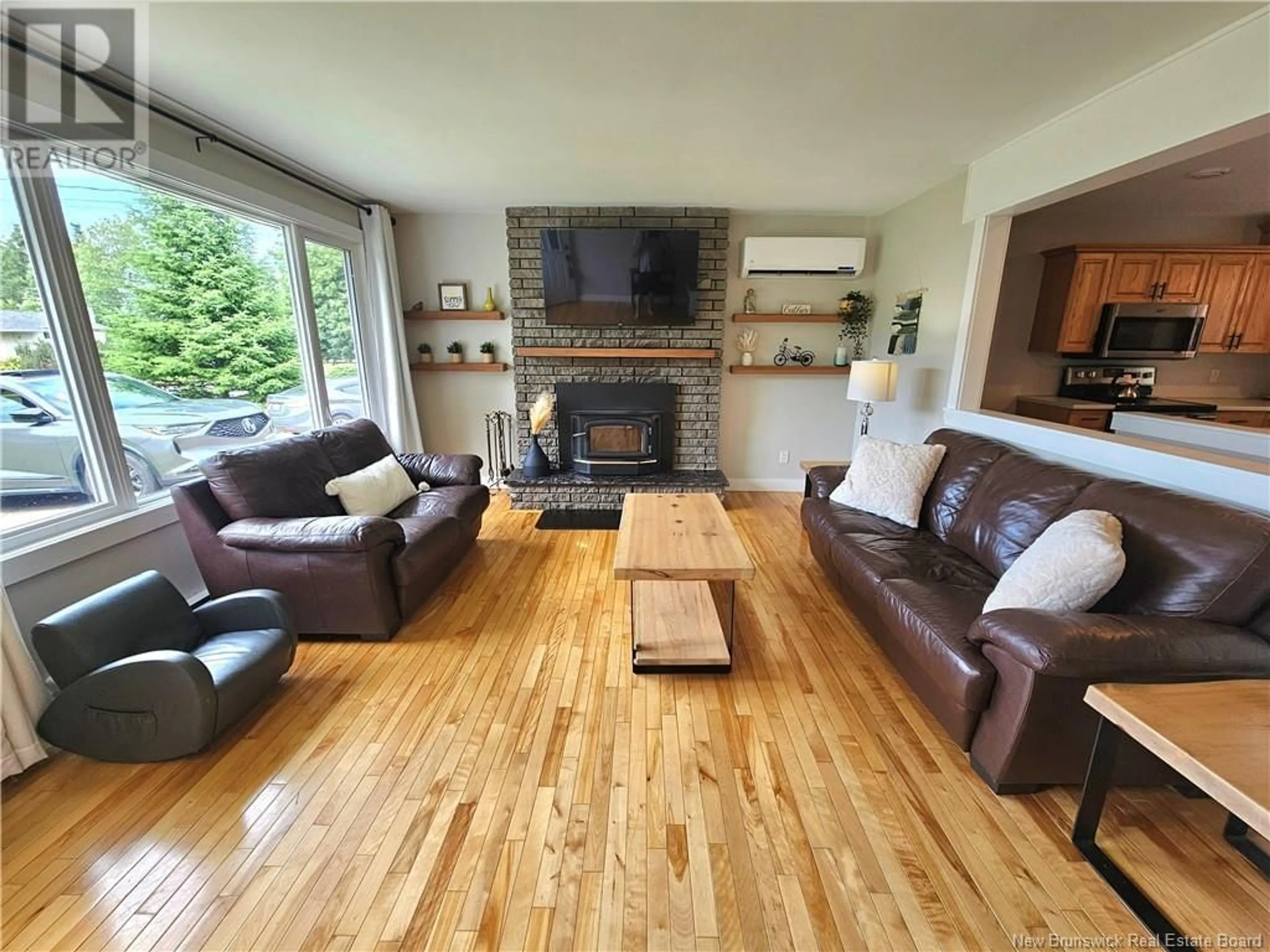 Living room with furniture, wood/laminate floor for 424 CHARTERSVILLE ROAD, Dieppe New Brunswick E1A5A1