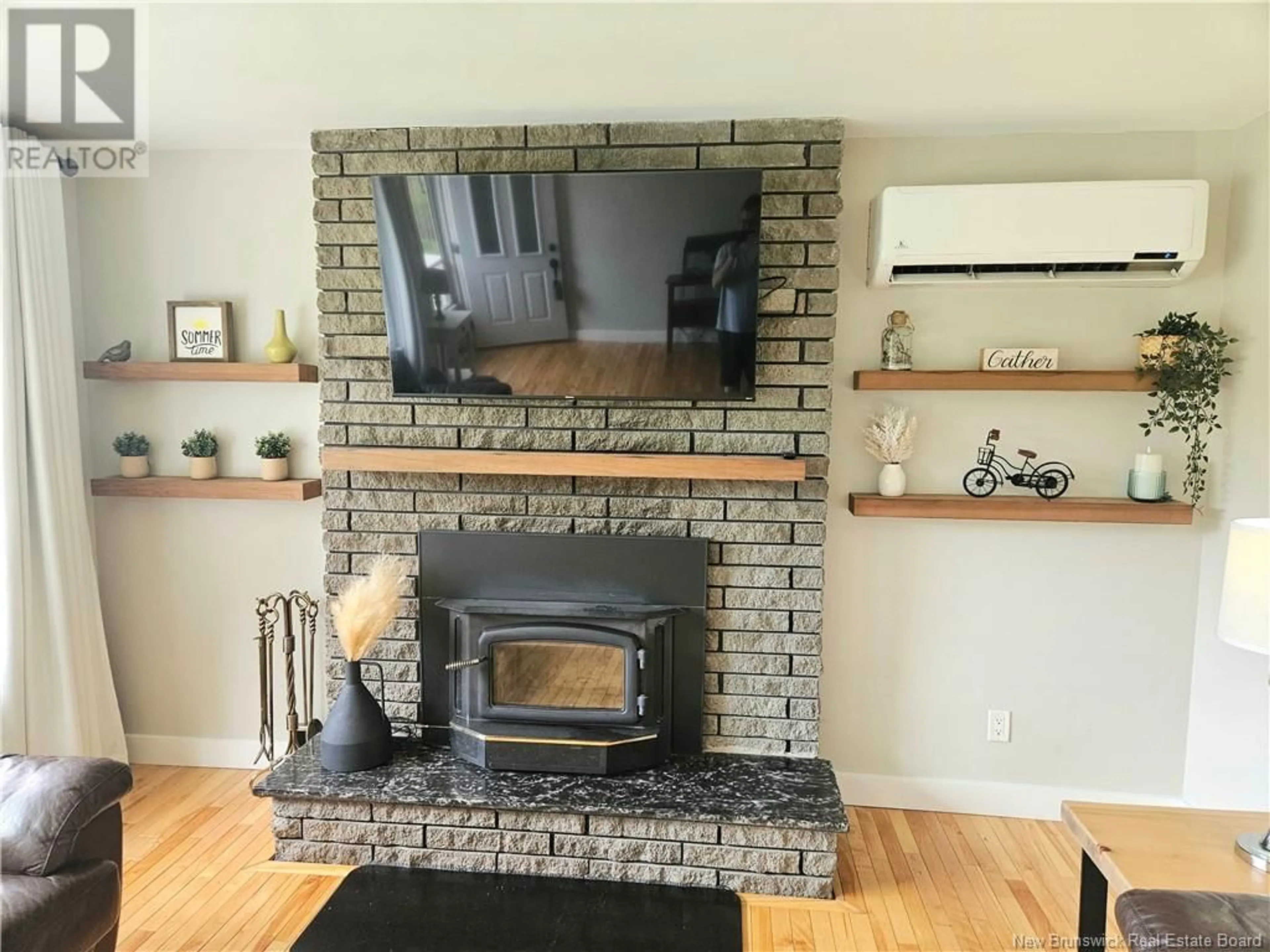 Living room with furniture, wood/laminate floor for 424 CHARTERSVILLE ROAD, Dieppe New Brunswick E1A5A1