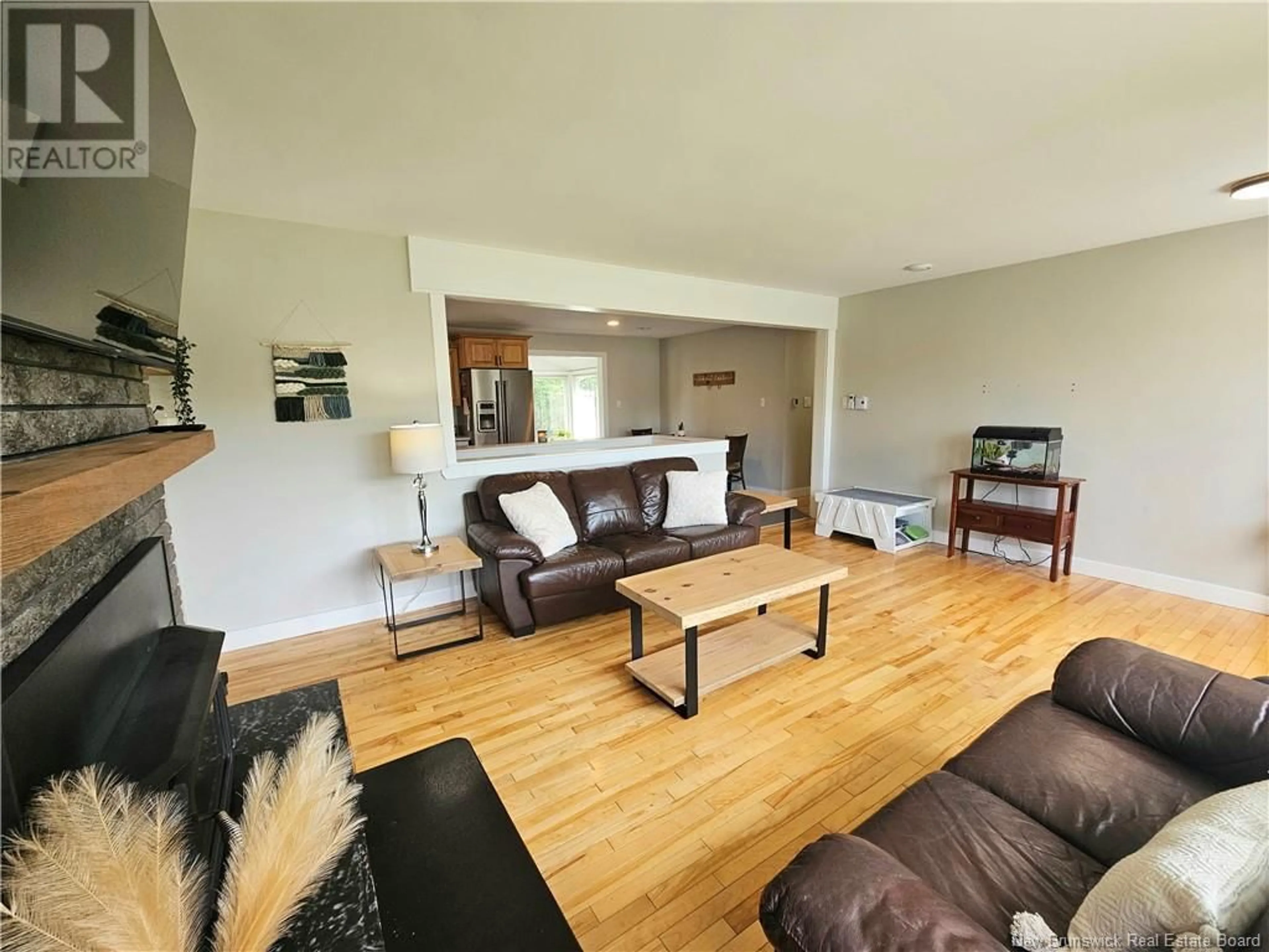 Living room with furniture, wood/laminate floor for 424 CHARTERSVILLE ROAD, Dieppe New Brunswick E1A5A1