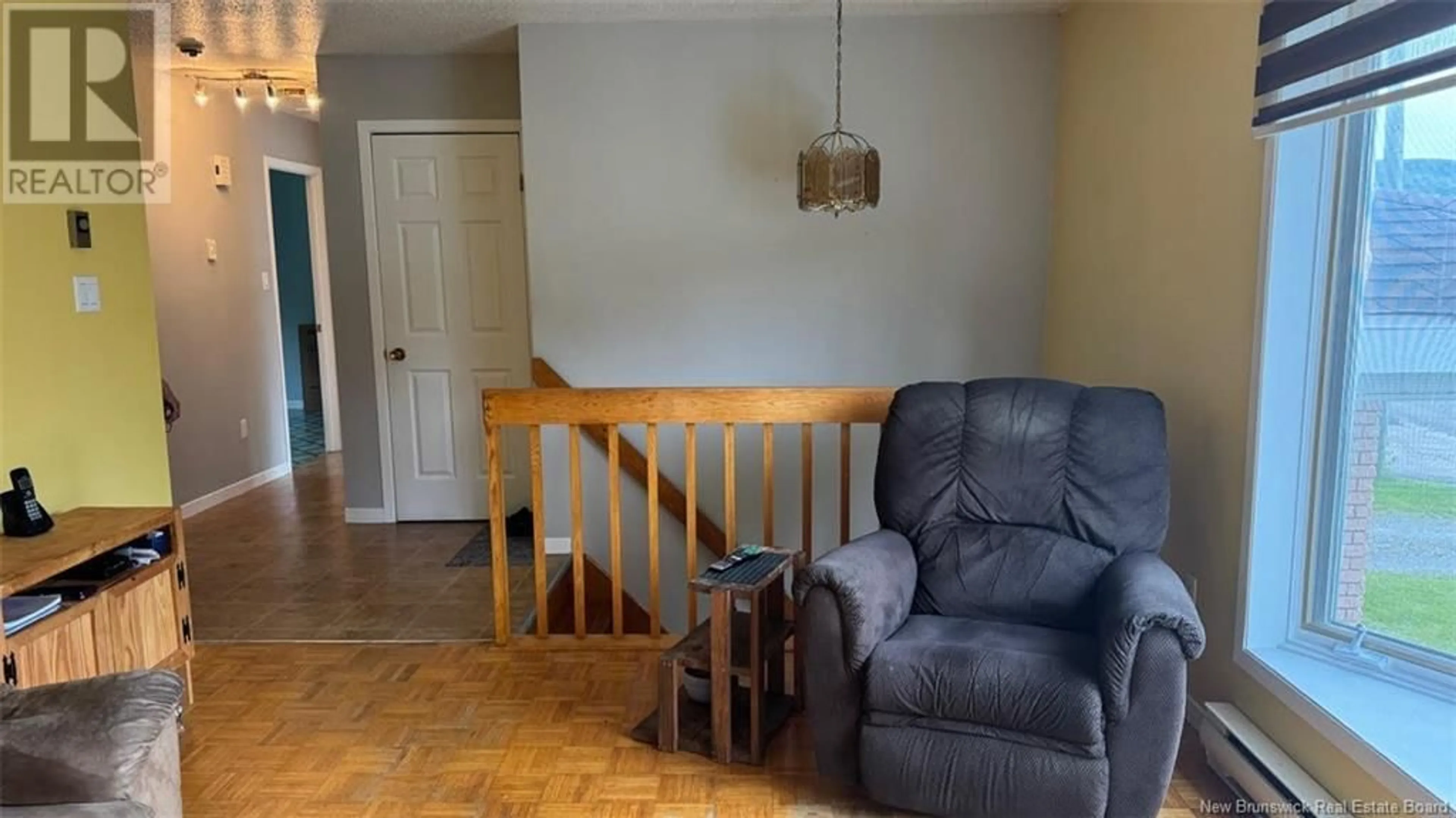 Living room with furniture, wood/laminate floor for 75-77 BELISLE AVENUE, Edmundston New Brunswick E3V3W9