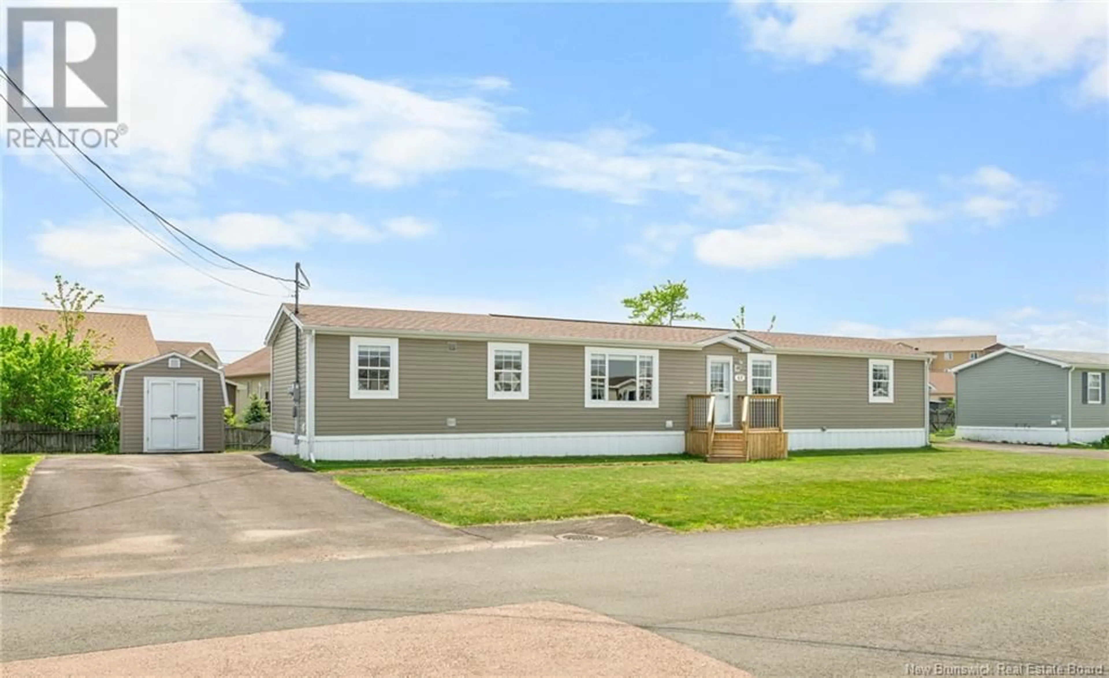 Home with vinyl exterior material, street for 43 TRACADIE DRIVE, Dieppe New Brunswick E1A8P2