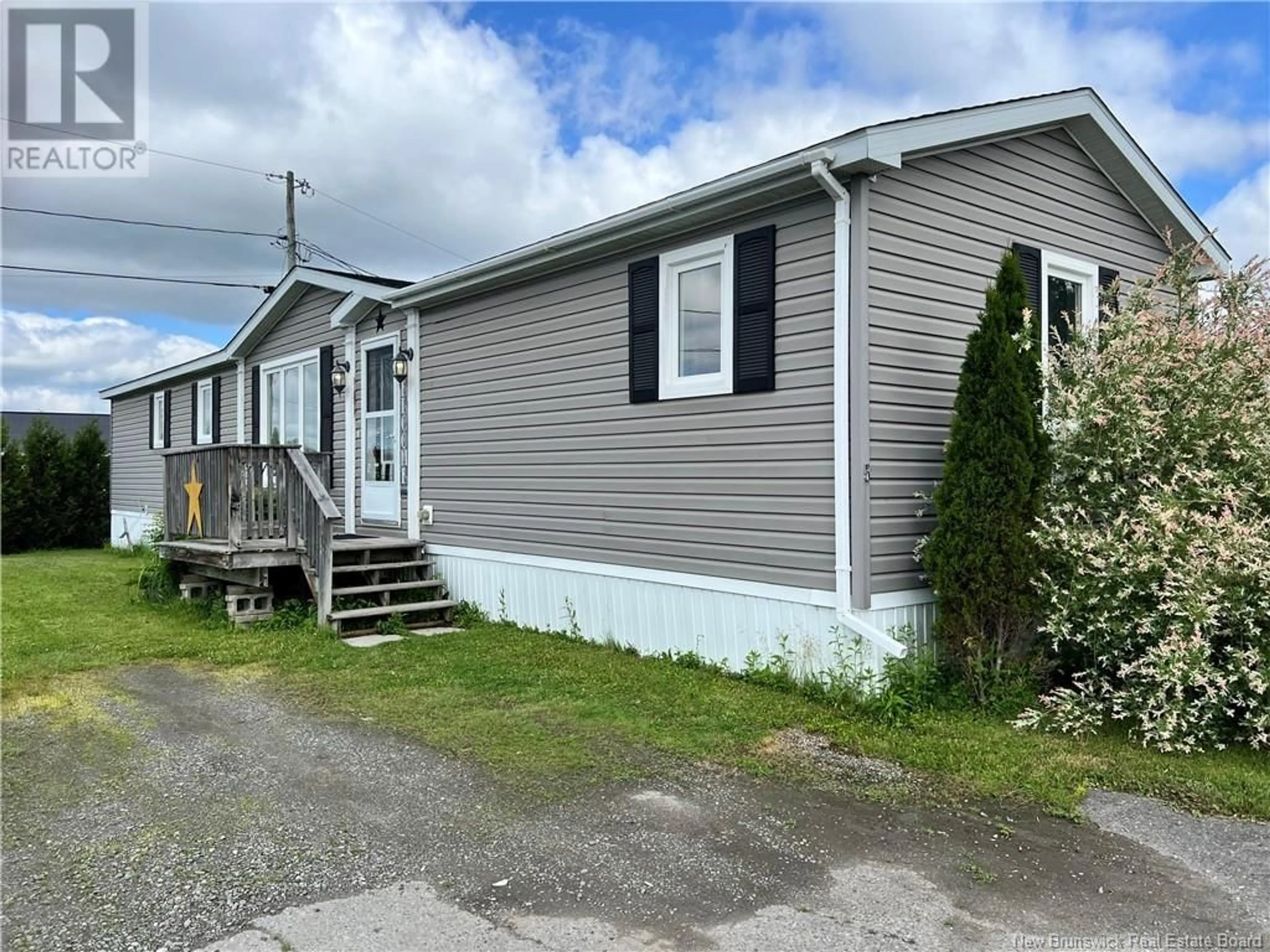 Home with vinyl exterior material, street for 5 FRASER STREET, St. Stephen New Brunswick E3L4B5