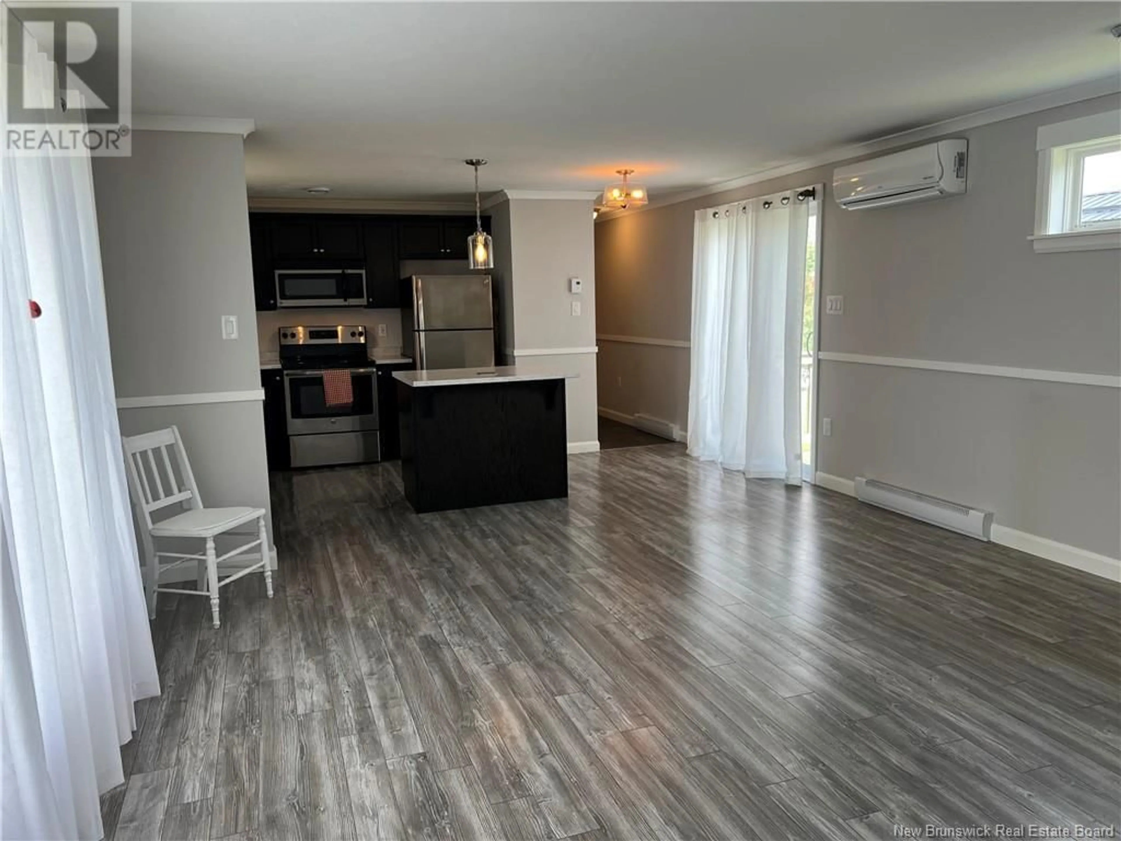 Open concept kitchen, wood/laminate floor for 5 FRASER STREET, St. Stephen New Brunswick E3L4B5