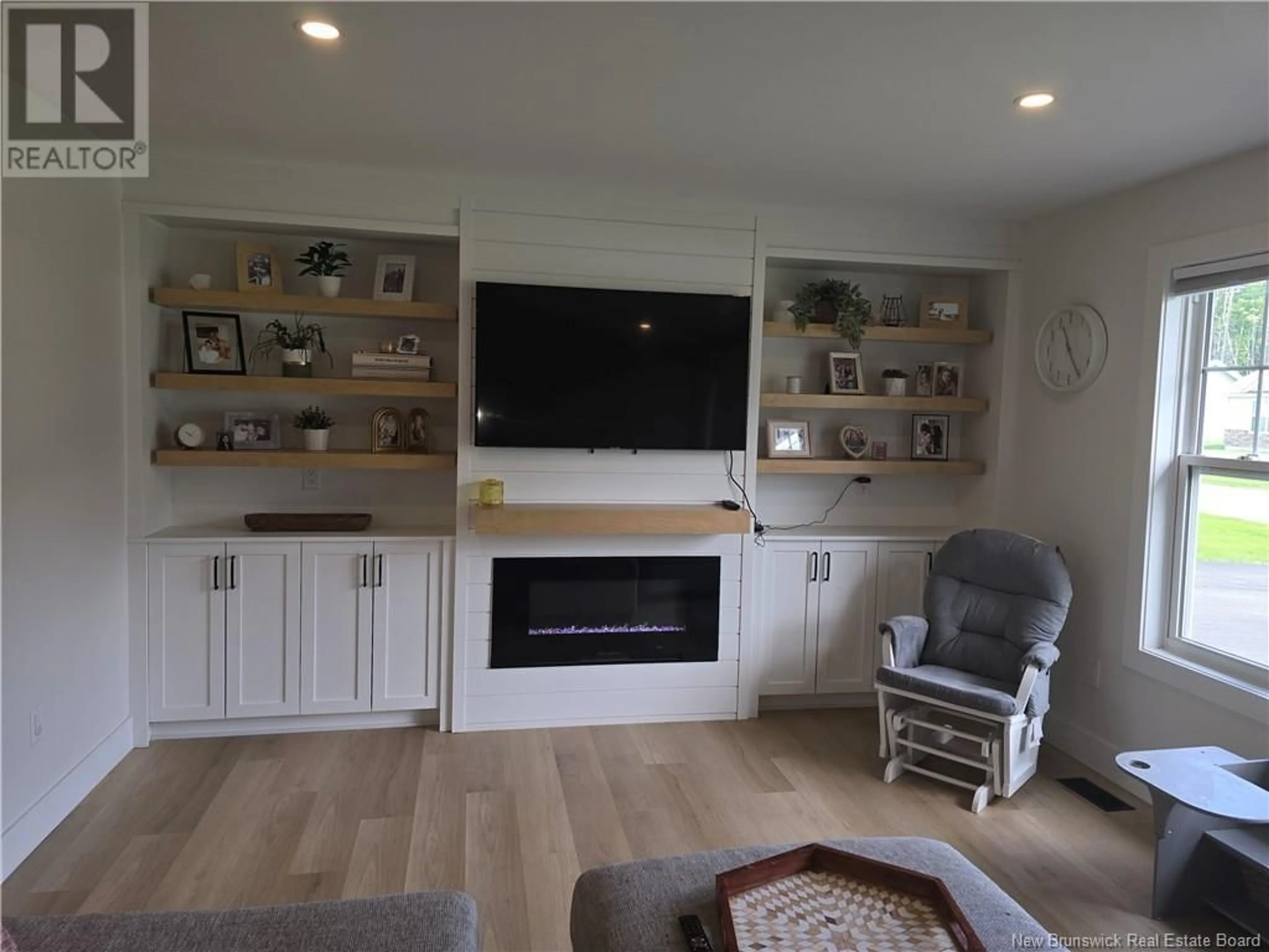 Living room with furniture, wood/laminate floor for 207 CARROLL STREET, Miramichi New Brunswick E1V0M3