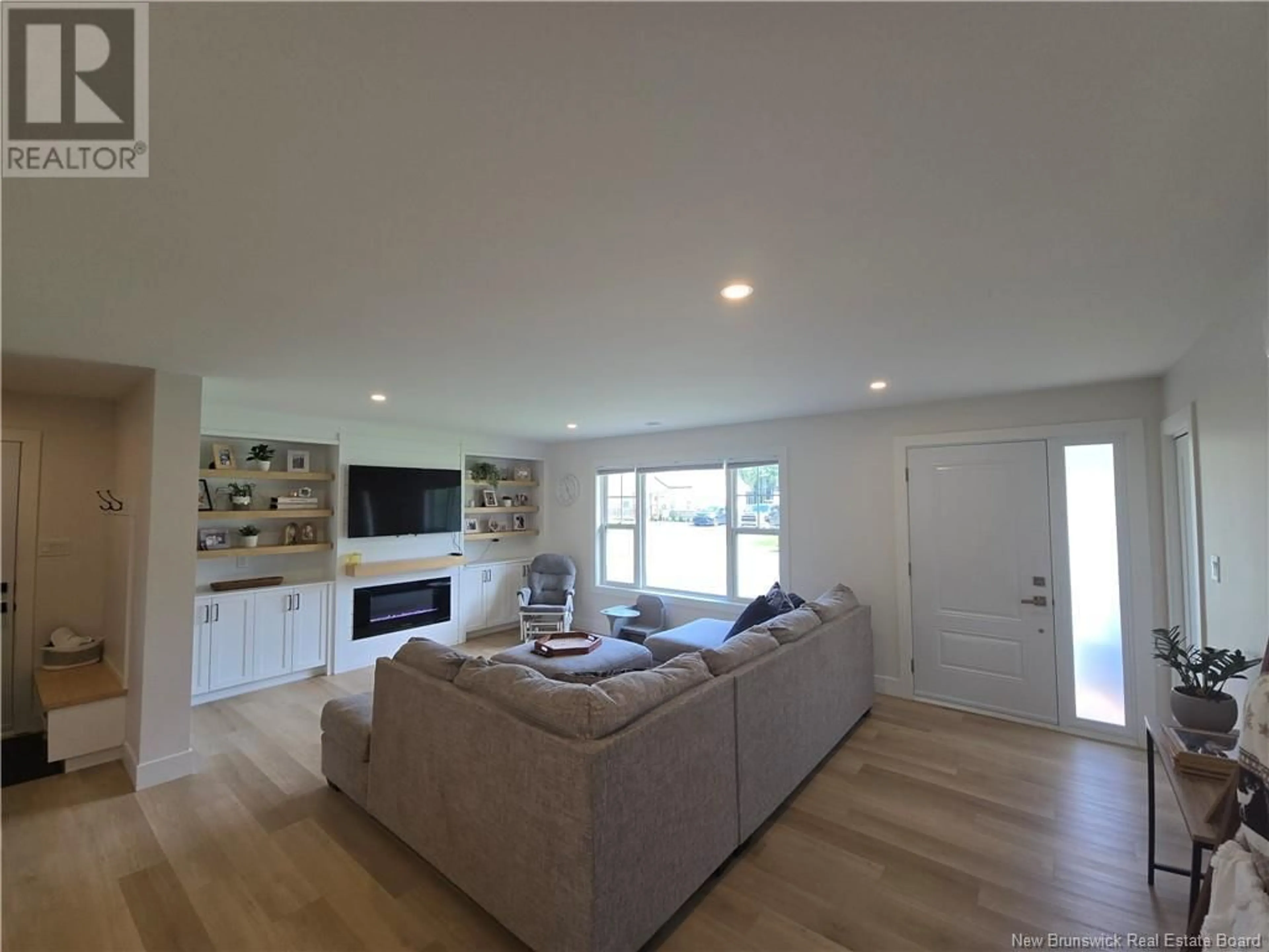 Living room with furniture, wood/laminate floor for 207 CARROLL STREET, Miramichi New Brunswick E1V0M3