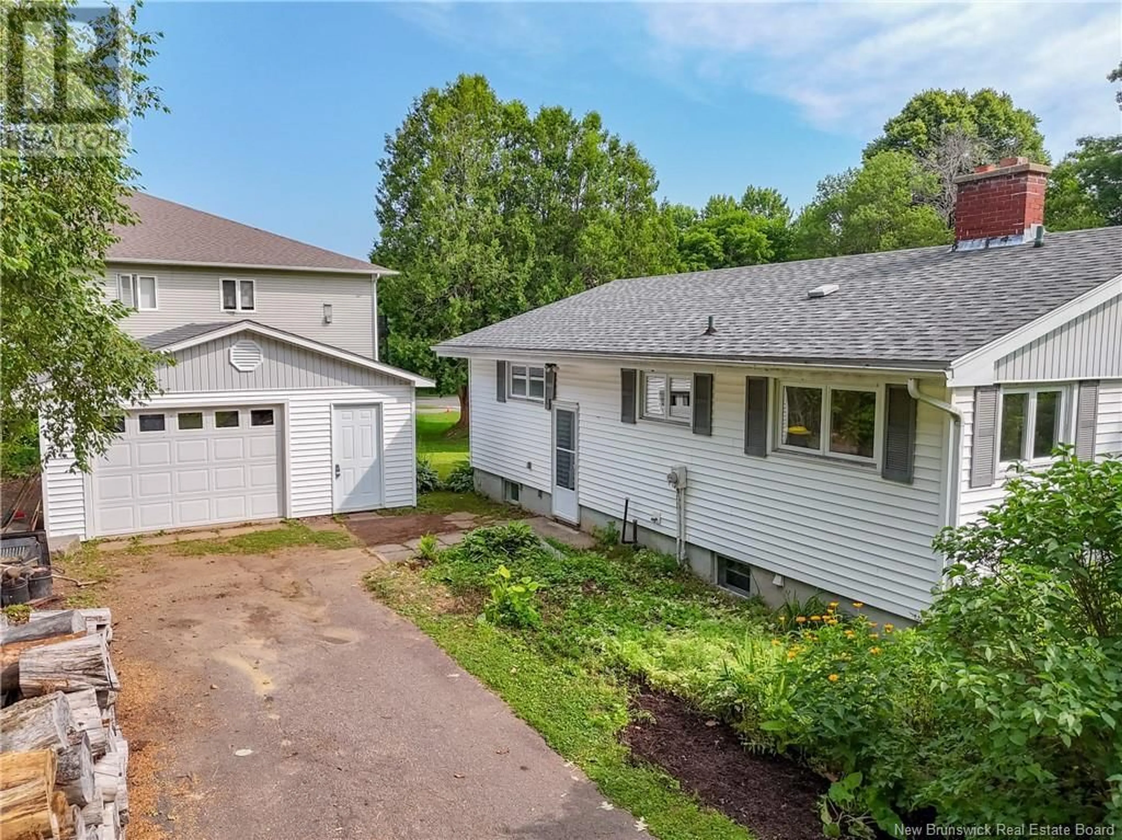 A pic from outside/outdoor area/front of a property/back of a property/a pic from drone, street for 59 BROAD ROAD, Oromocto New Brunswick E2V1C3