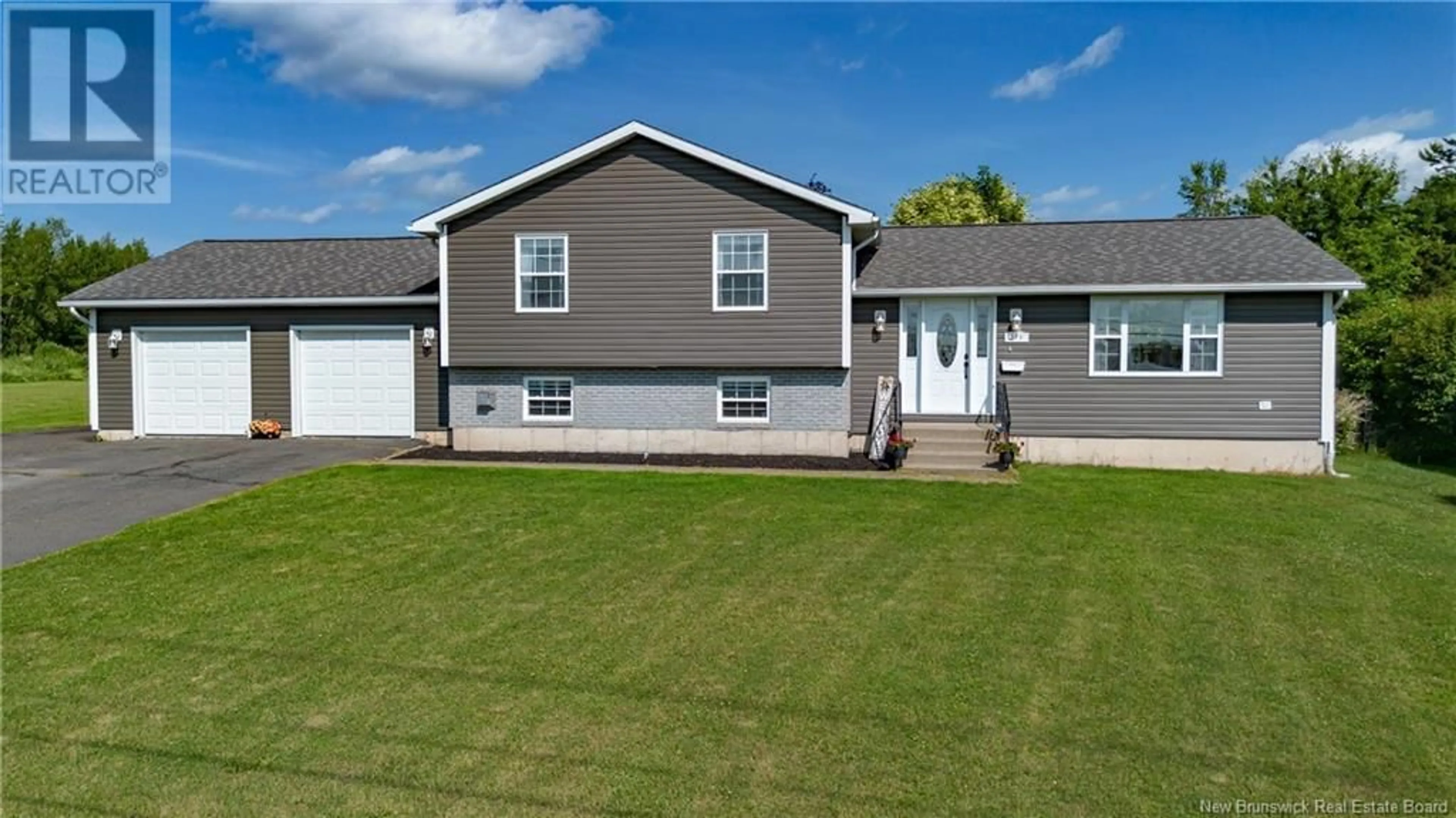 Home with vinyl exterior material, street for 779 WAASIS ROAD, Oromocto New Brunswick E2V2N4