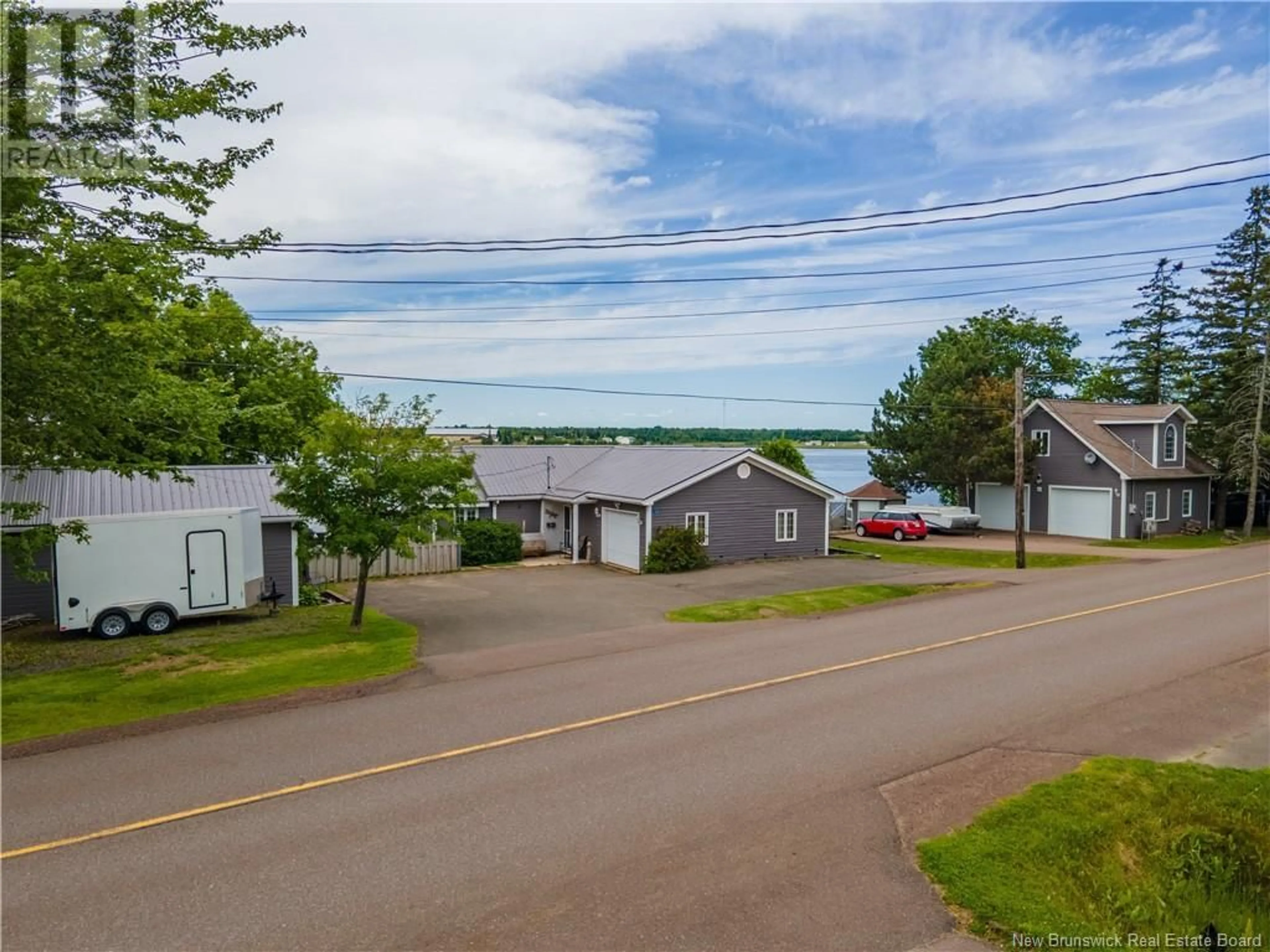 A pic from outside/outdoor area/front of a property/back of a property/a pic from drone, water/lake/river/ocean view for 132 CHEMIN COCAGNE SUD, Cocagne New Brunswick E4R2K5