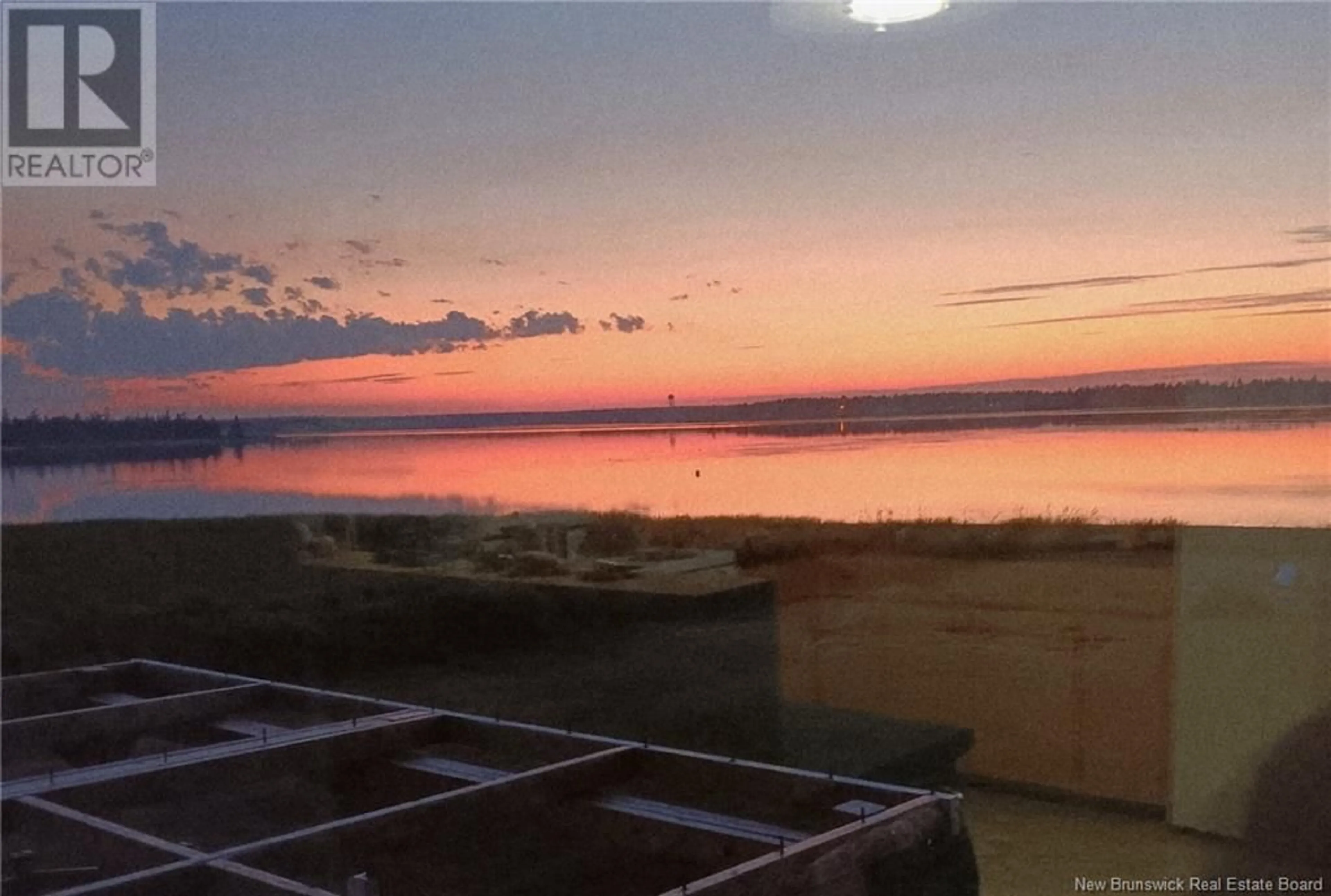 A pic from outside/outdoor area/front of a property/back of a property/a pic from drone, water/lake/river/ocean view for 229 DU PARC, Val-Comeau New Brunswick E1X4B6