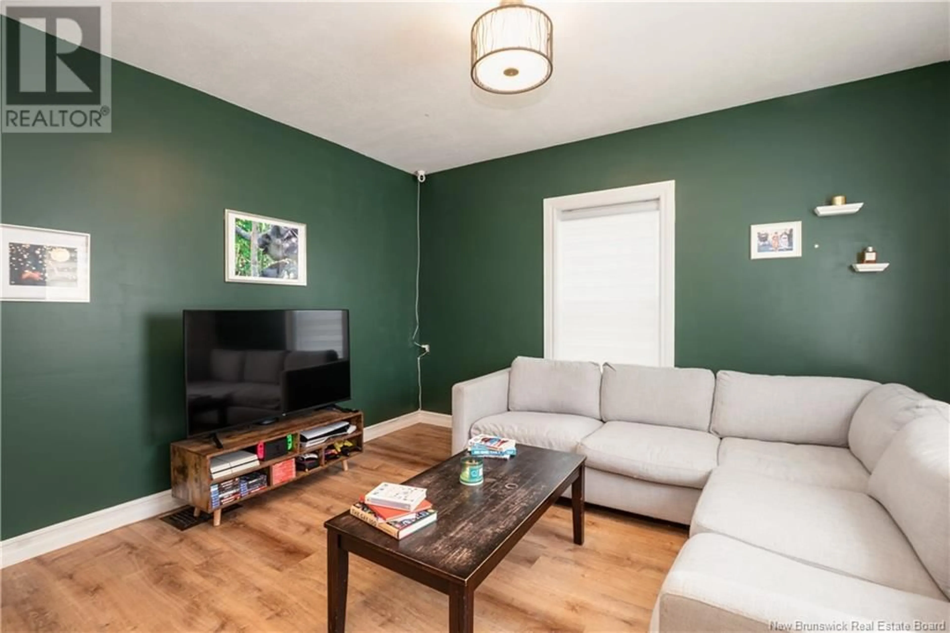 Living room with furniture, wood/laminate floor for 263 JOHN STREET, Moncton New Brunswick E1C2J5