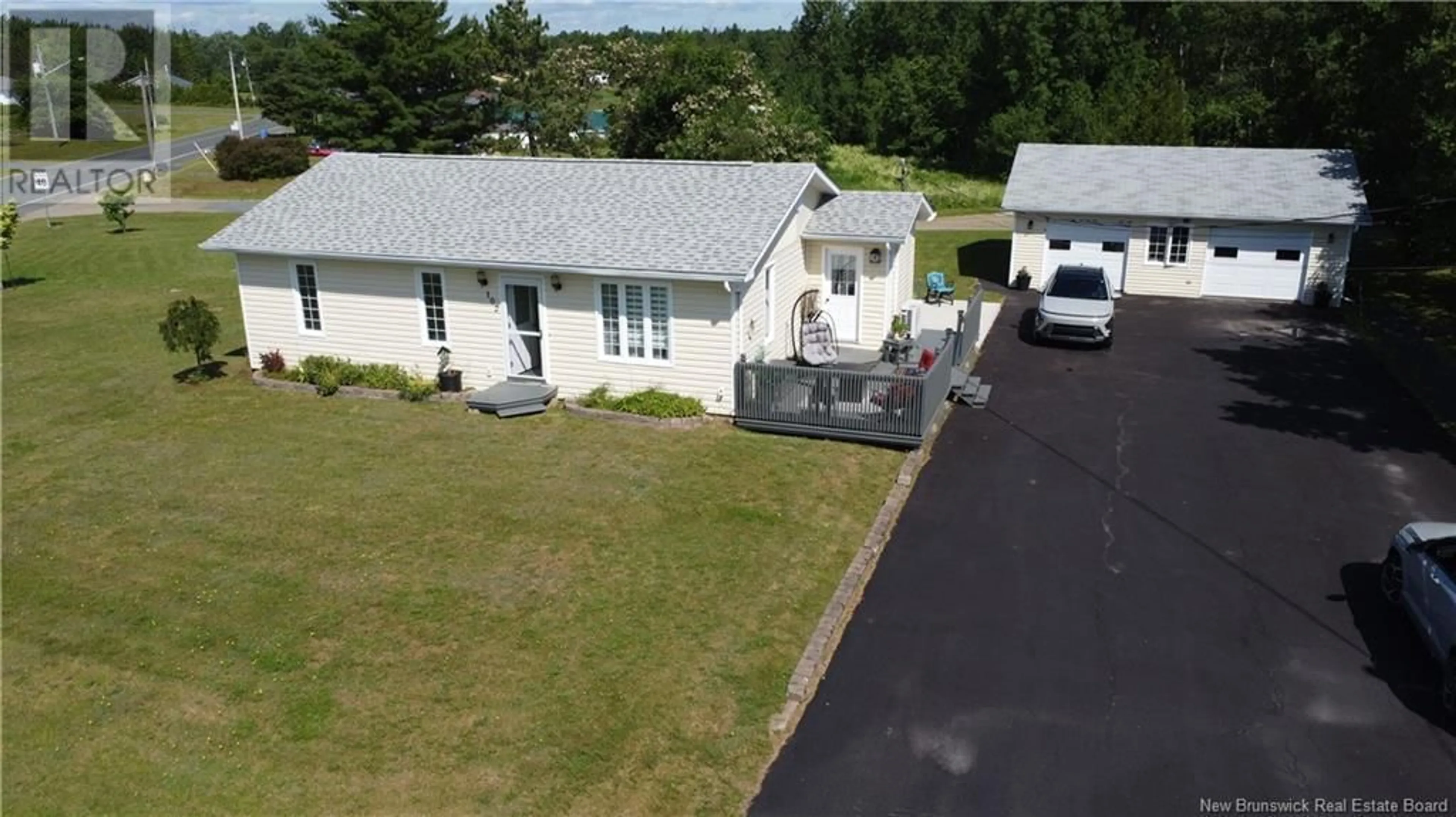 A pic from outside/outdoor area/front of a property/back of a property/a pic from drone, street for 102 KENT LODGE, Beresford New Brunswick E8K1B1