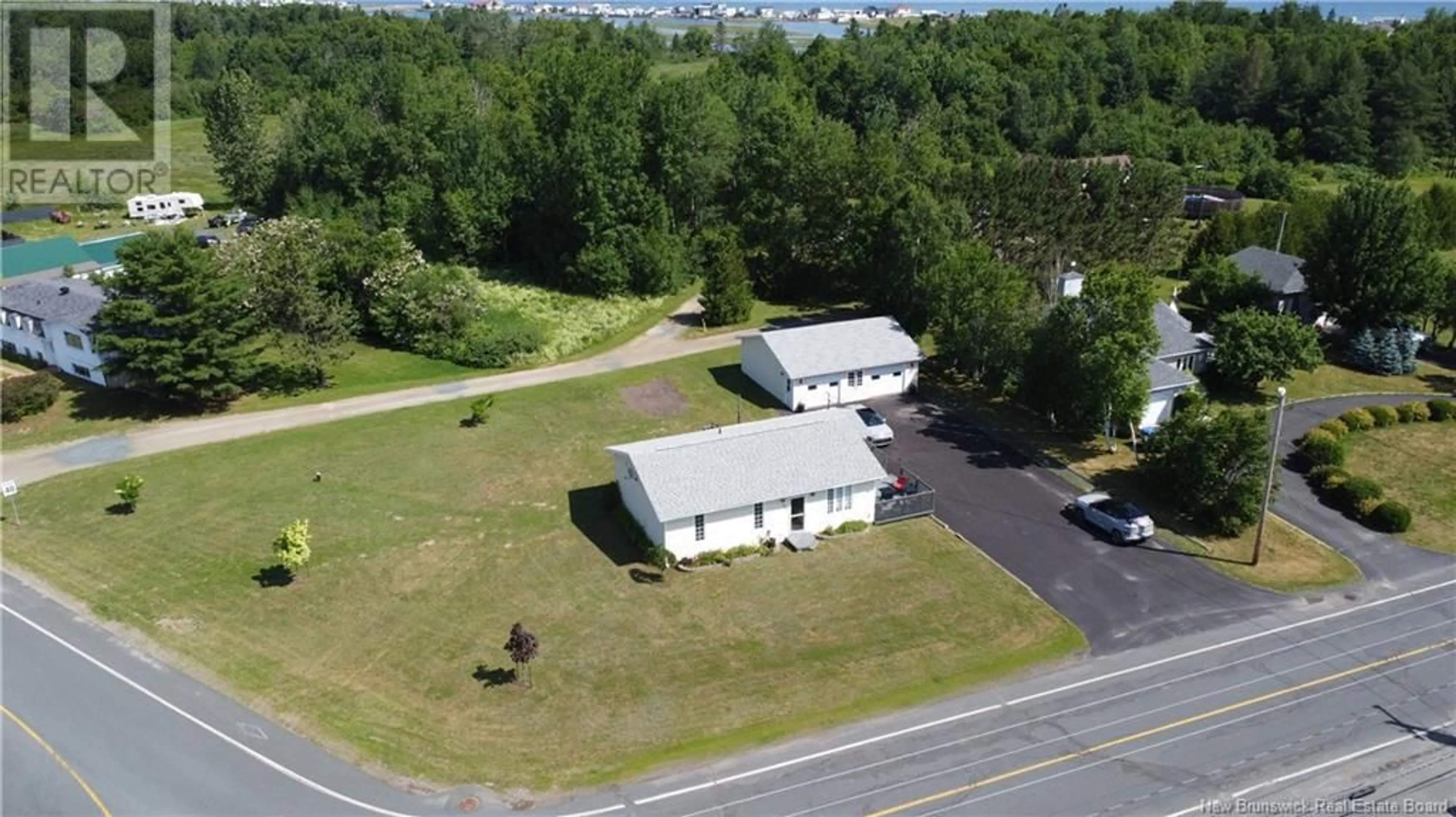 A pic from outside/outdoor area/front of a property/back of a property/a pic from drone, building for 102 KENT LODGE, Beresford New Brunswick E8K1B1