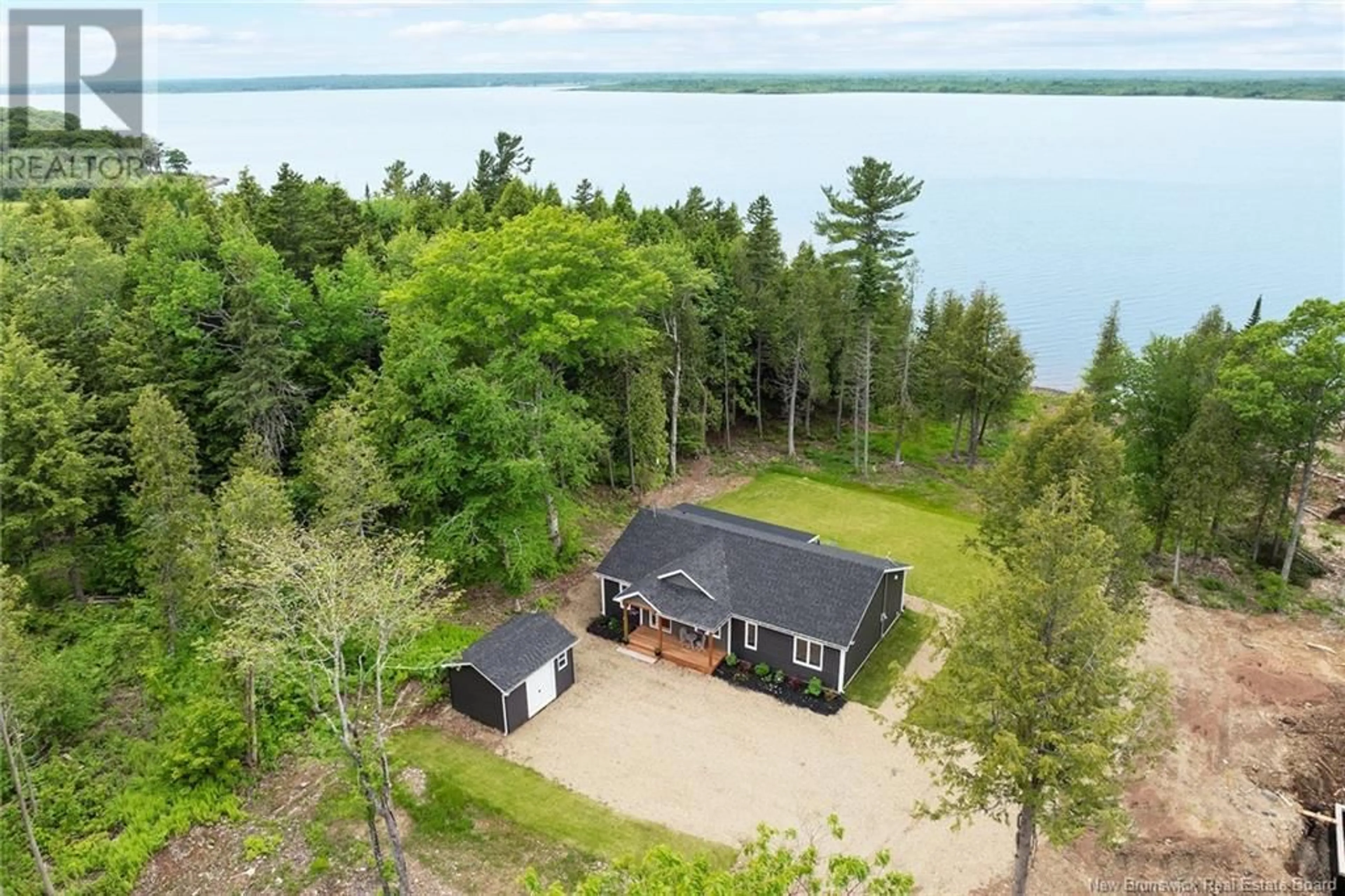 A pic from outside/outdoor area/front of a property/back of a property/a pic from drone, water/lake/river/ocean view for 456 COX POINT ROAD, Cumberland Bay New Brunswick E4A3N9