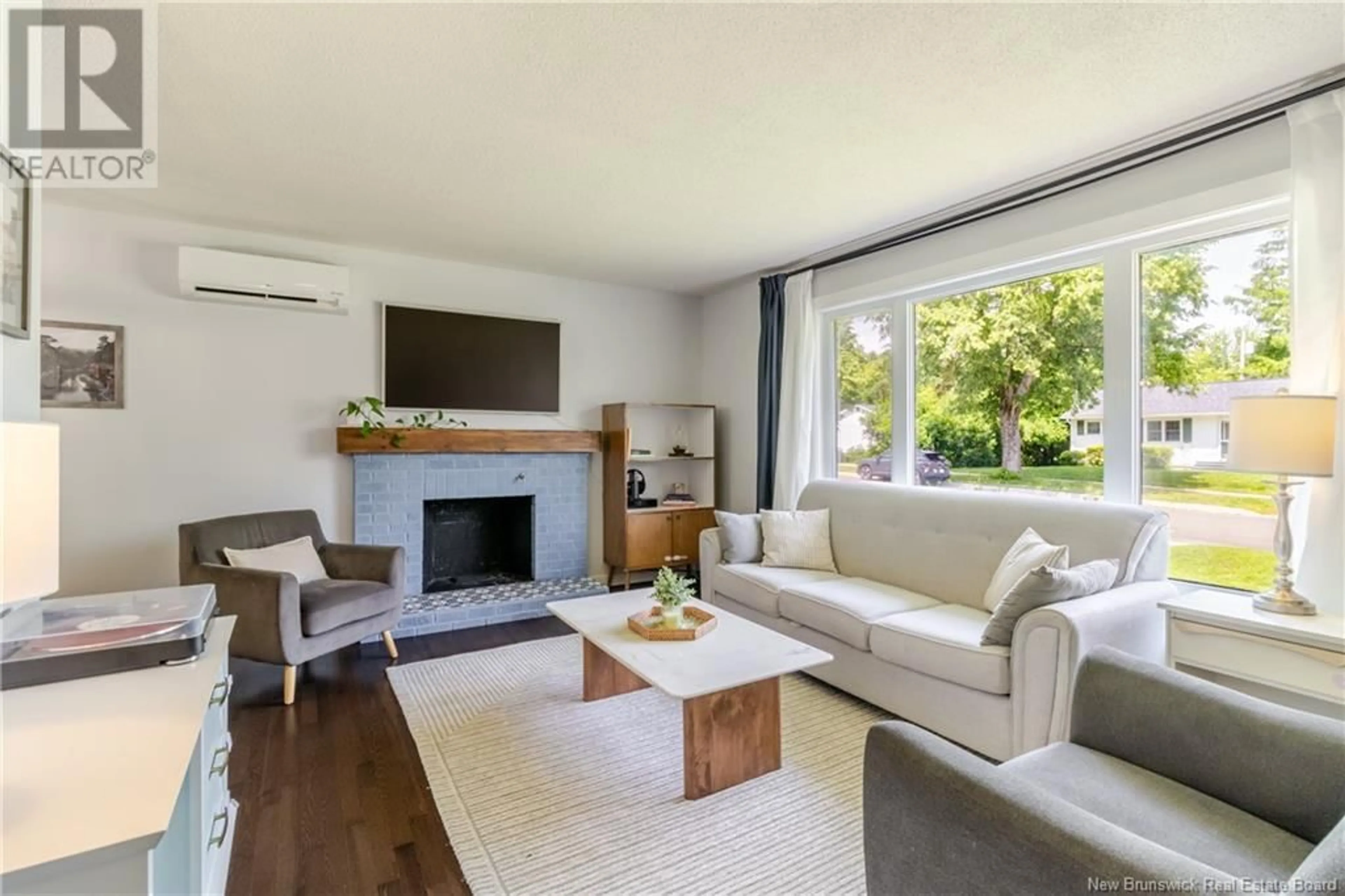 Living room with furniture, wood/laminate floor for 106 DOVER CRESCENT, Fredericton New Brunswick E3B4T9