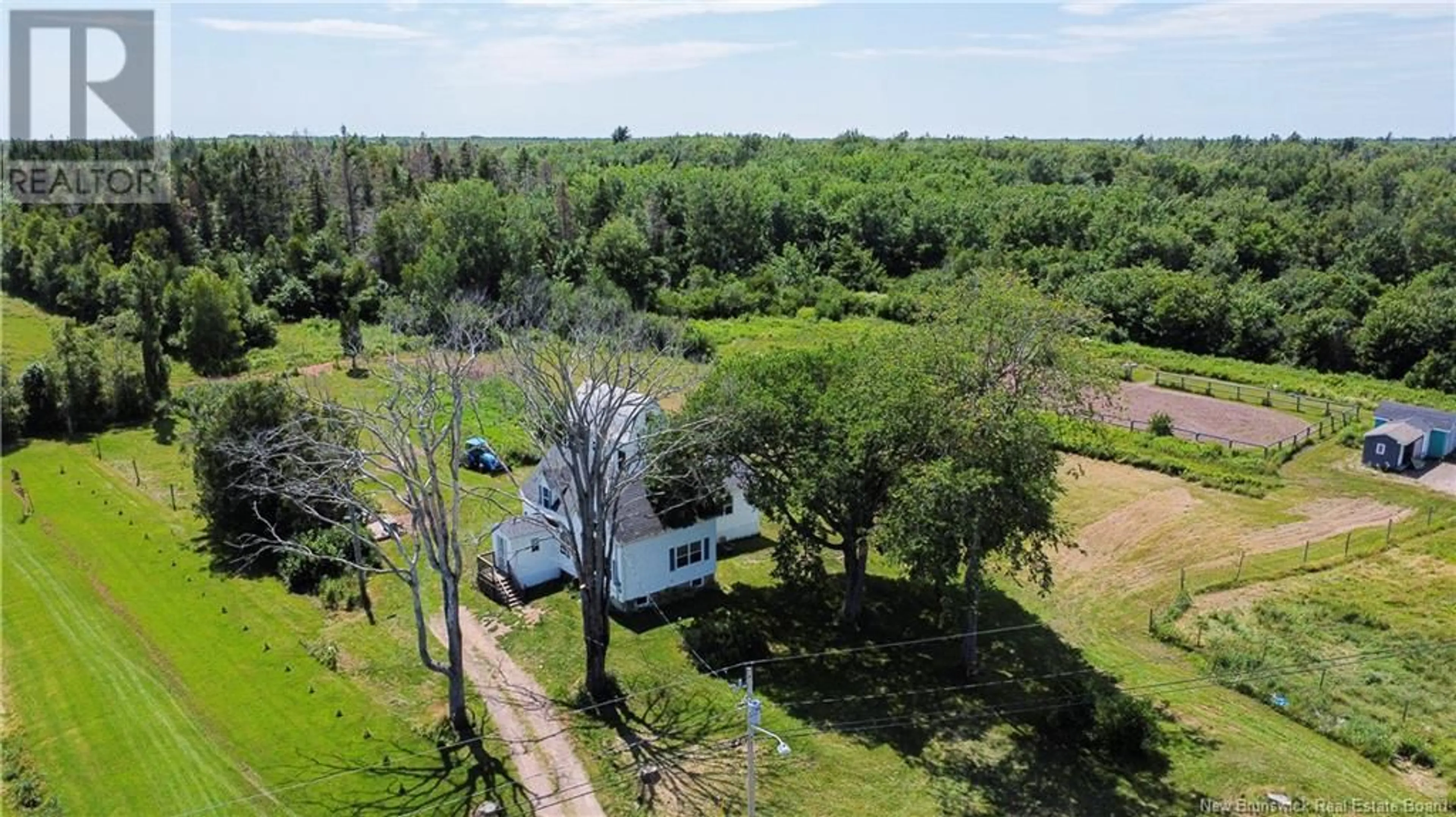 A pic from outside/outdoor area/front of a property/back of a property/a pic from drone, forest/trees view for 535 CH LEBLANC, Saint-Andre-LeBlanc New Brunswick E4P6B2