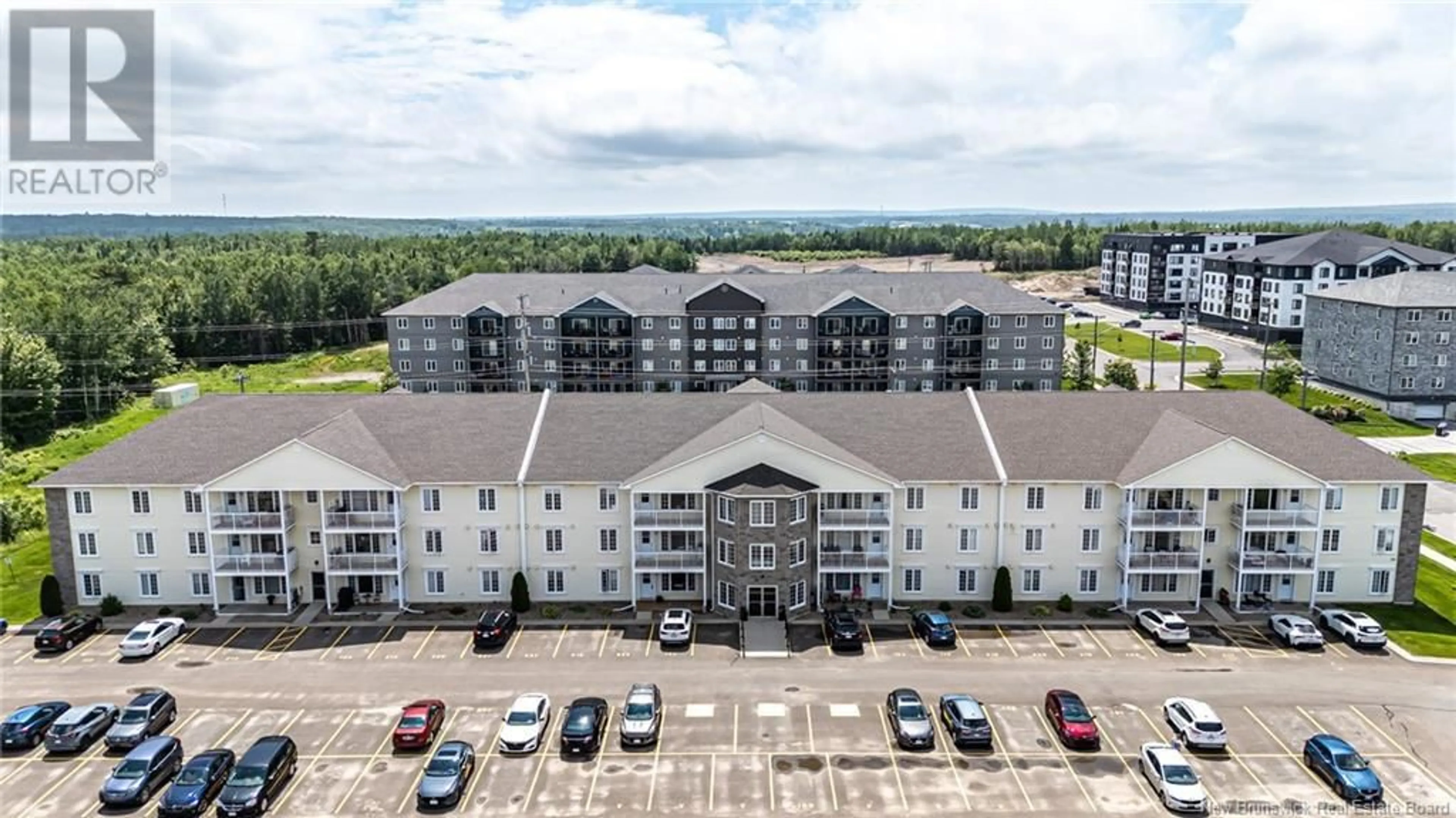 A pic from outside/outdoor area/front of a property/back of a property/a pic from drone, building for 220 - 130 LIAN STREET, Fredericton New Brunswick E3C0G4