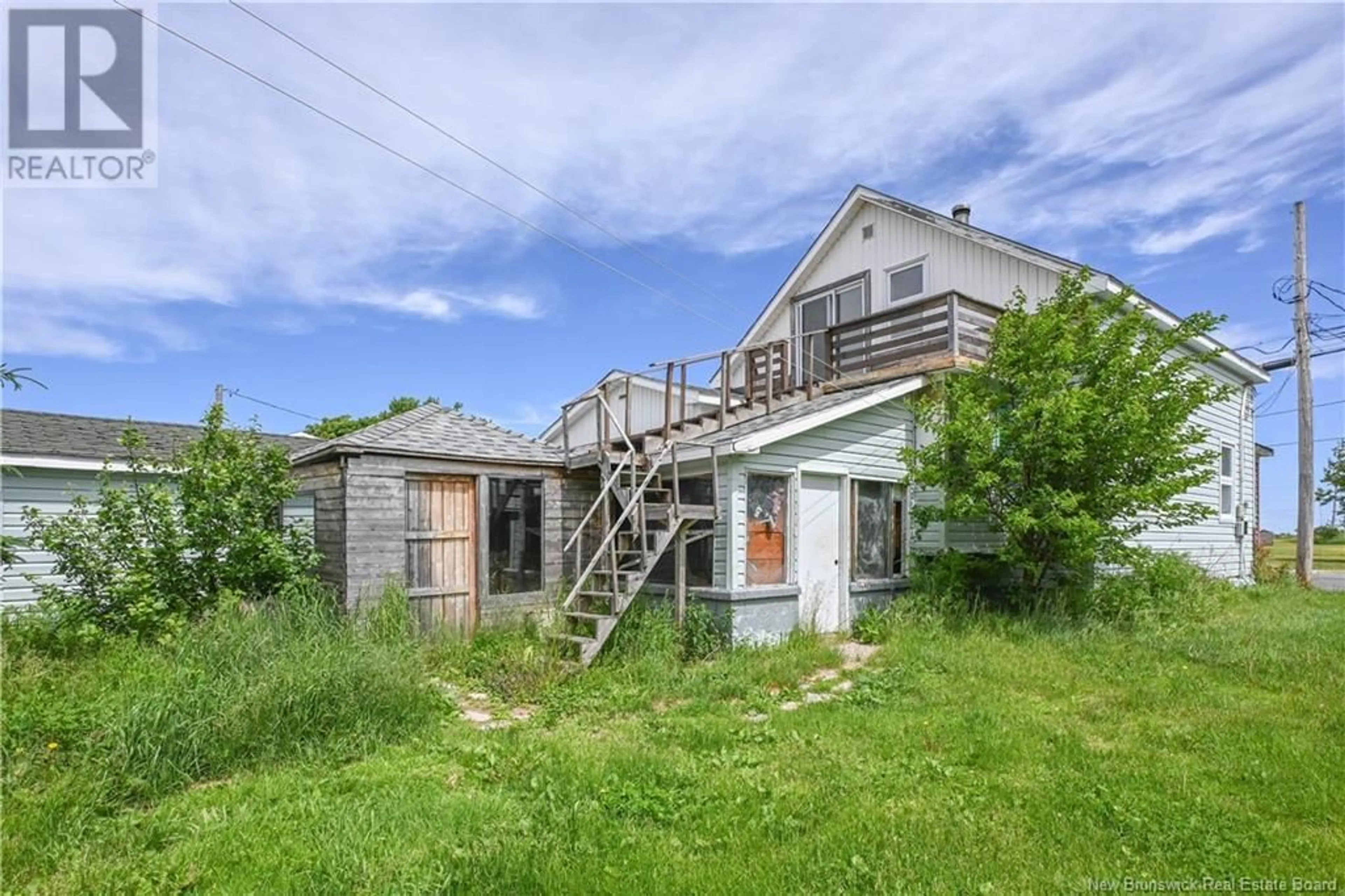 A pic from outside/outdoor area/front of a property/back of a property/a pic from drone, building for 311 JD GAUTHIER BOULEVARD, Shippagan New Brunswick E8S1N7