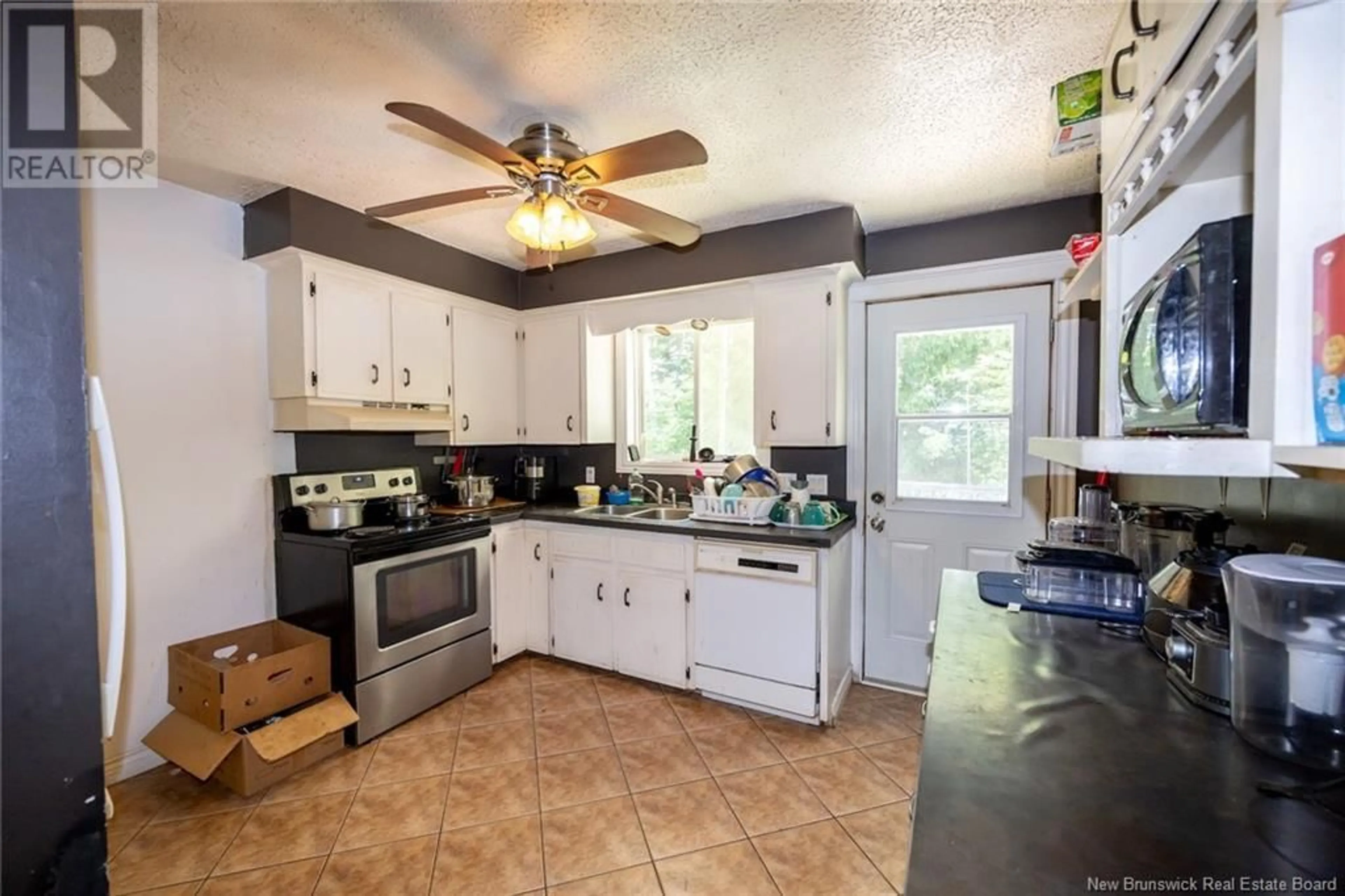 Open concept kitchen, ceramic/tile floor for 84 PUGSLEY STREET, Fredericton New Brunswick E3B6J4