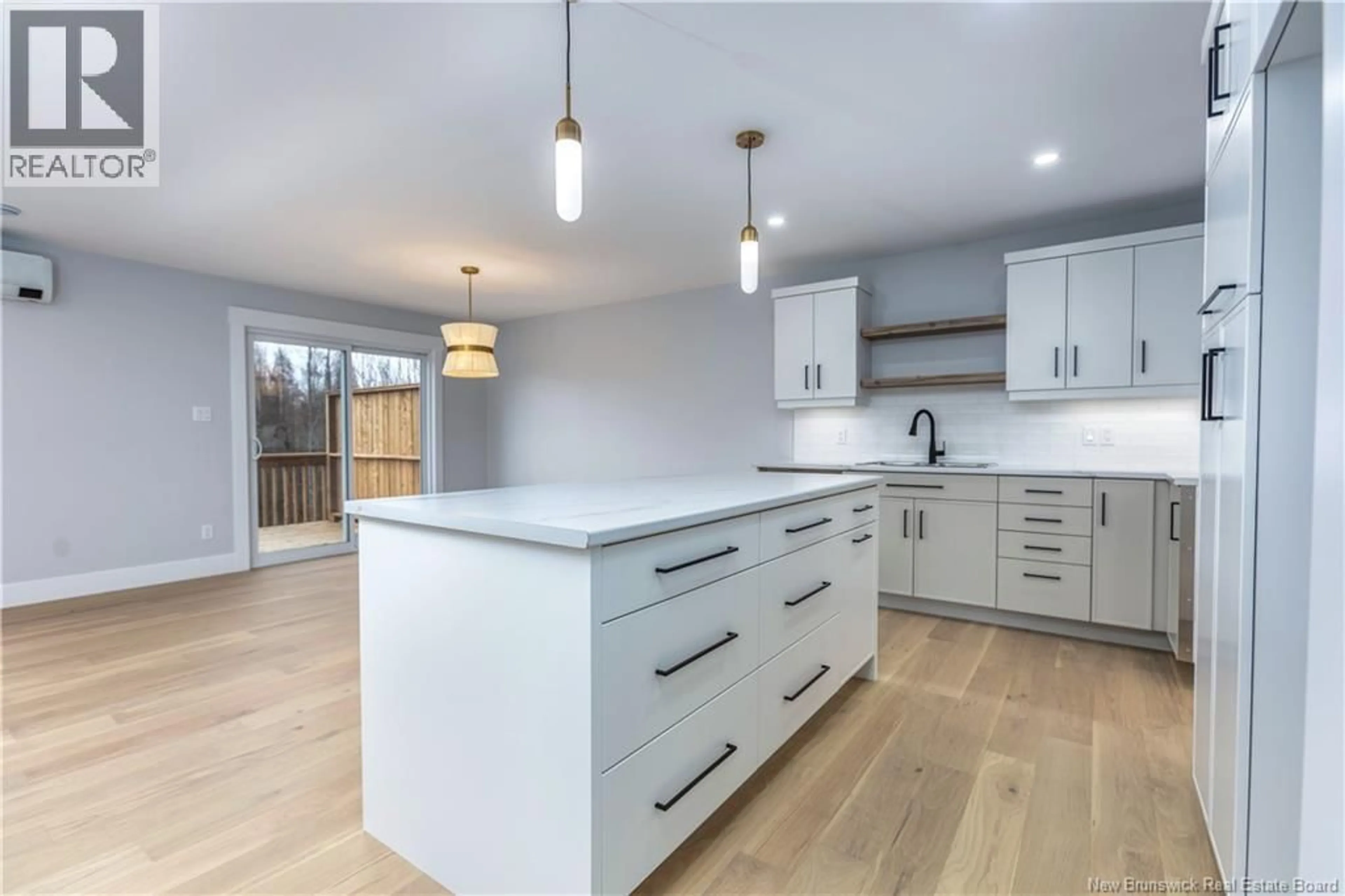 Open concept kitchen, wood/laminate floor for 34 BELFRY STREET, Moncton New Brunswick E1G5B6