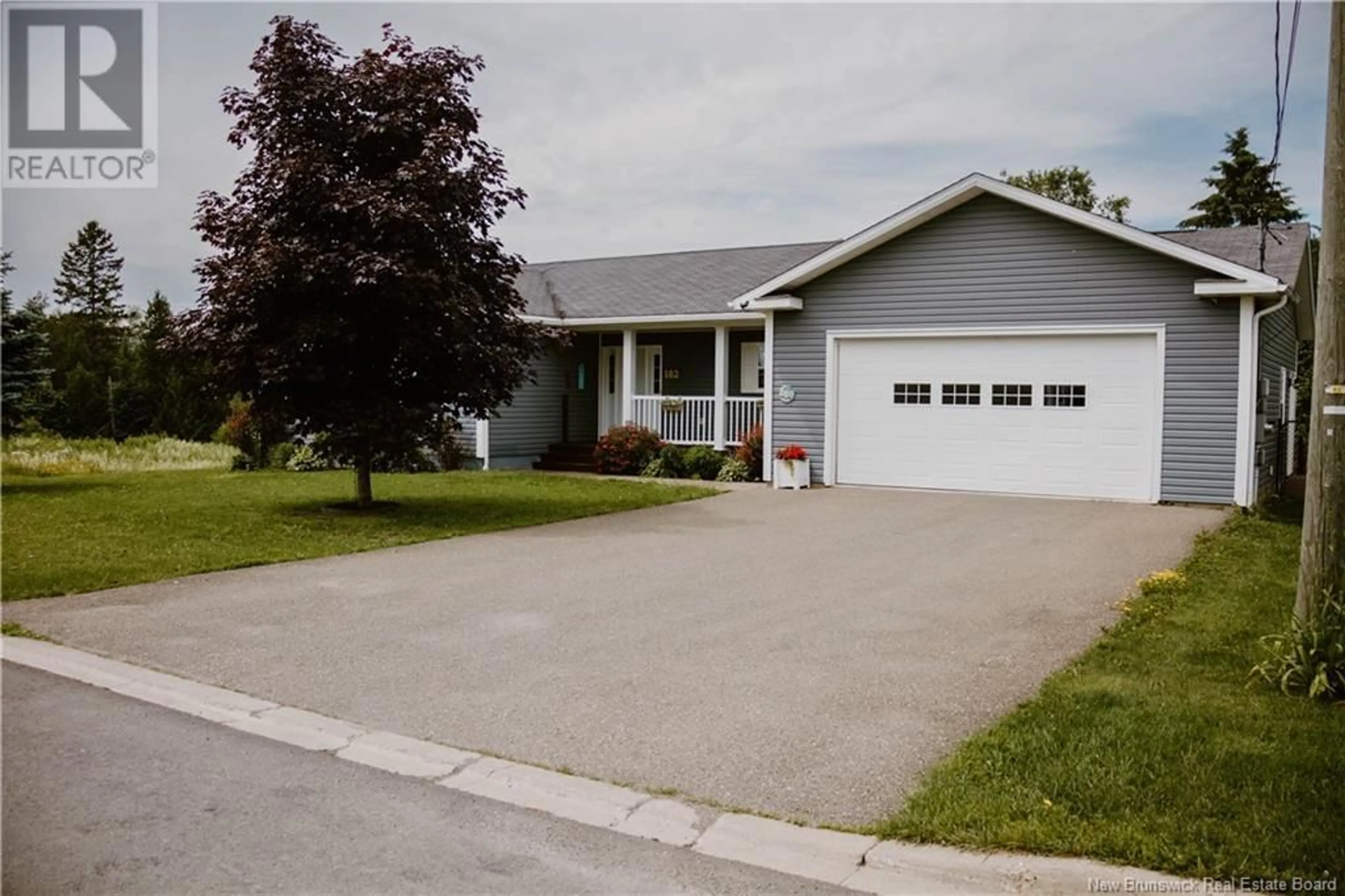Home with vinyl exterior material, street for 182 EASTWOOD DRIVE, Woodstock New Brunswick E7M3Z5