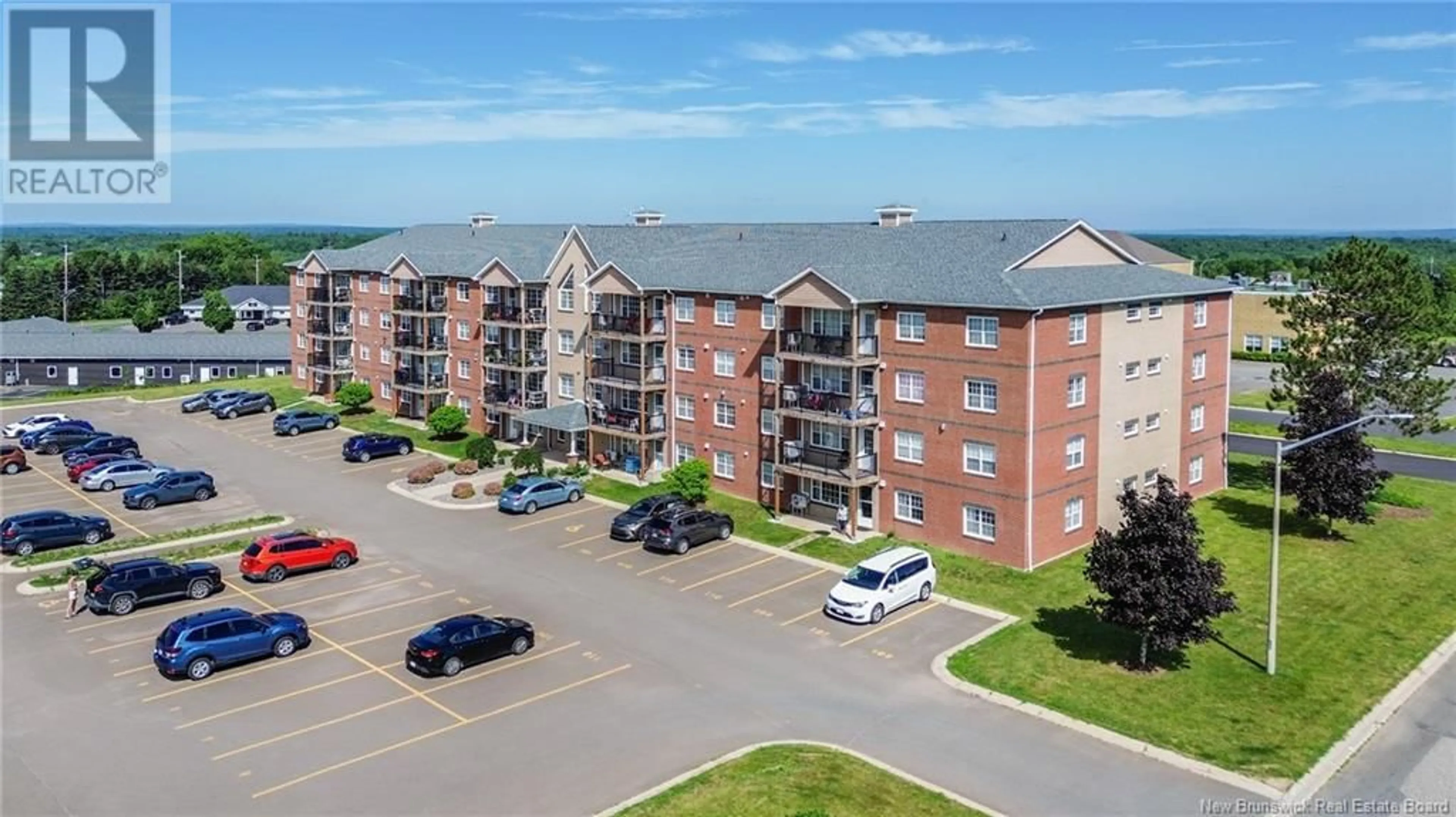 A pic from outside/outdoor area/front of a property/back of a property/a pic from drone, building for 405 - 65 BRAYSON BOULEVARD, Oromocto New Brunswick E2V0J2