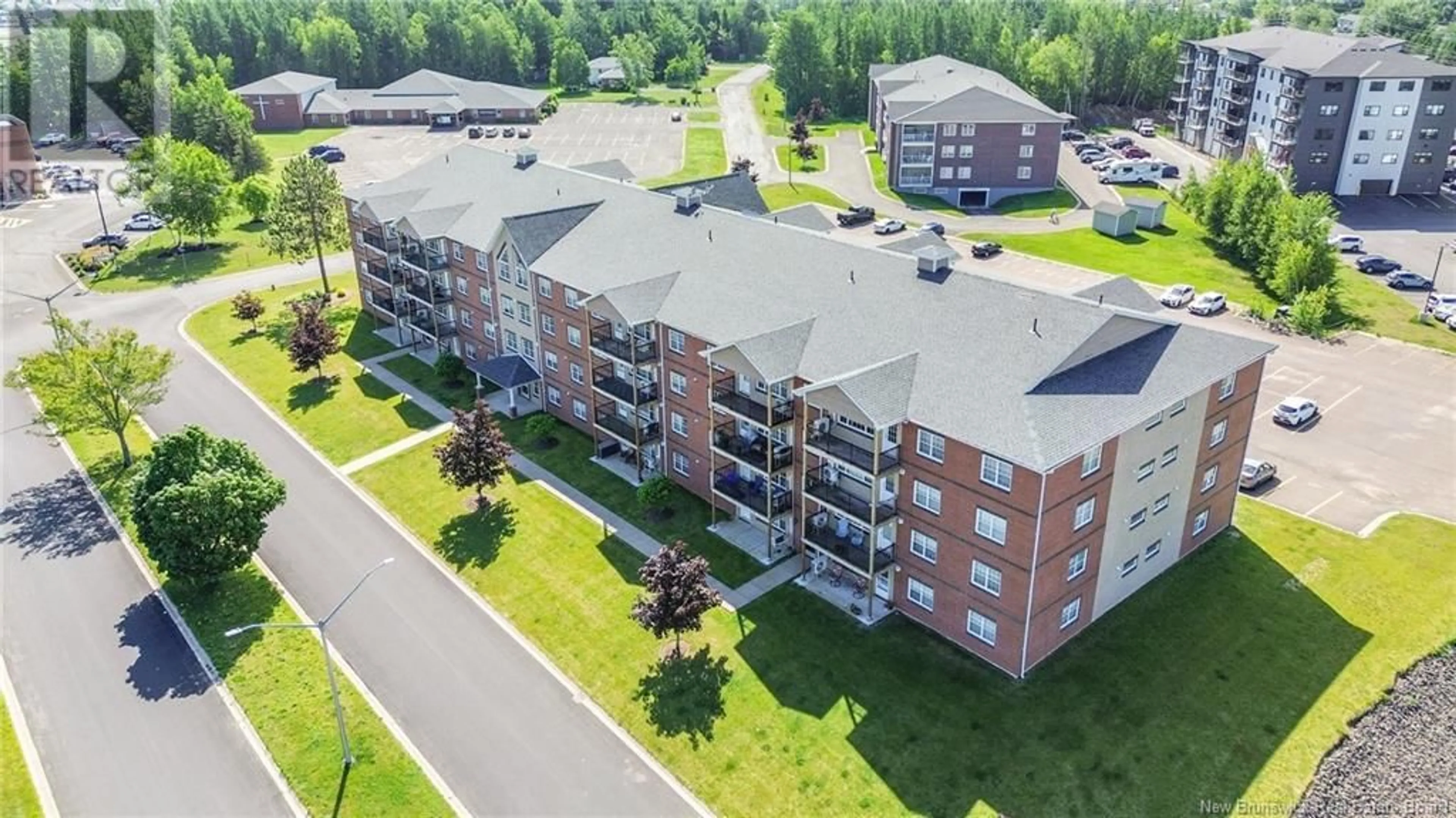 A pic from outside/outdoor area/front of a property/back of a property/a pic from drone, building for 405 - 65 BRAYSON BOULEVARD, Oromocto New Brunswick E2V0J2