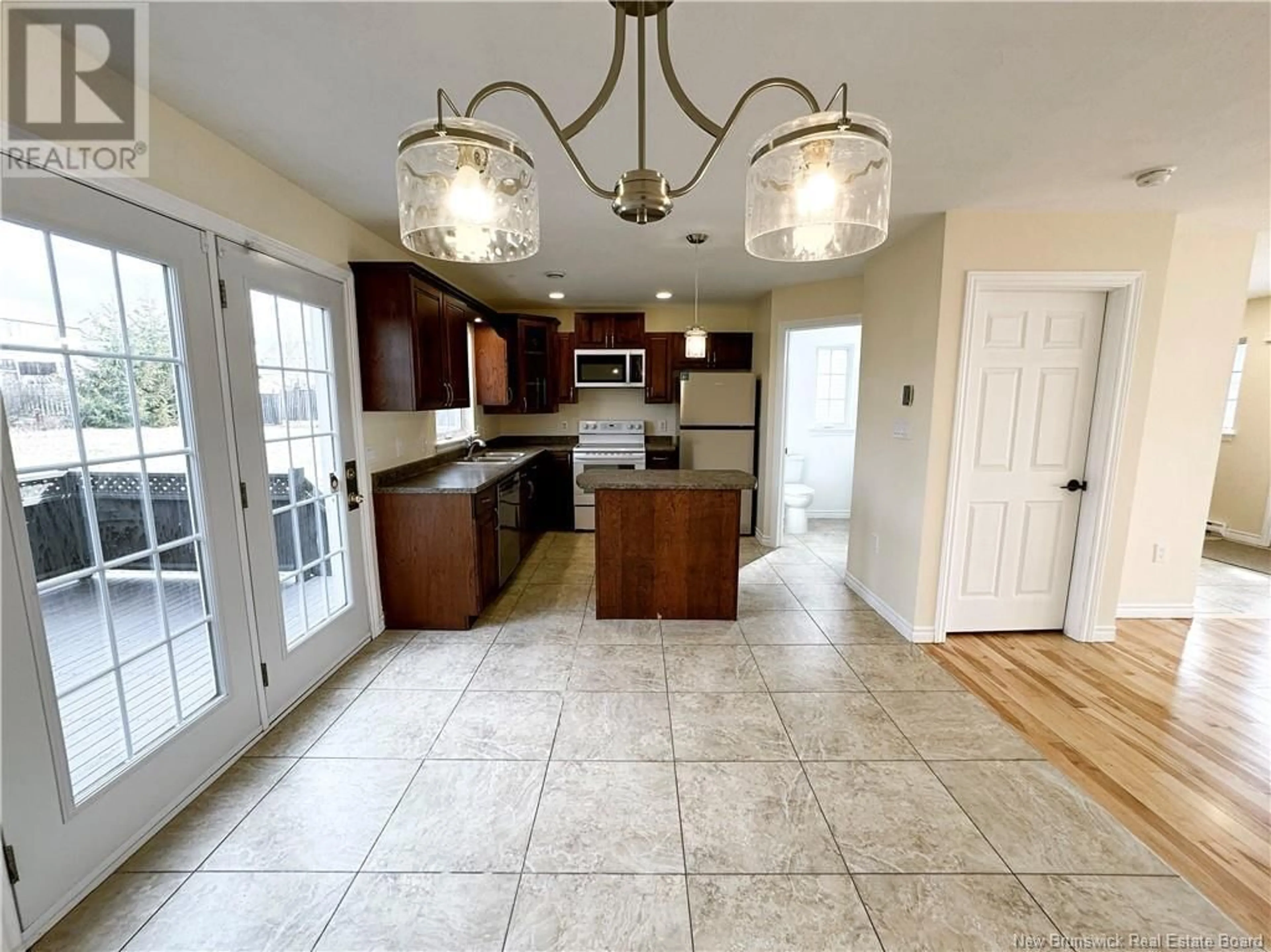 Open concept kitchen, ceramic/tile floor for 40 MOSSYOAK CRESCENT, Moncton New Brunswick E1G0J7
