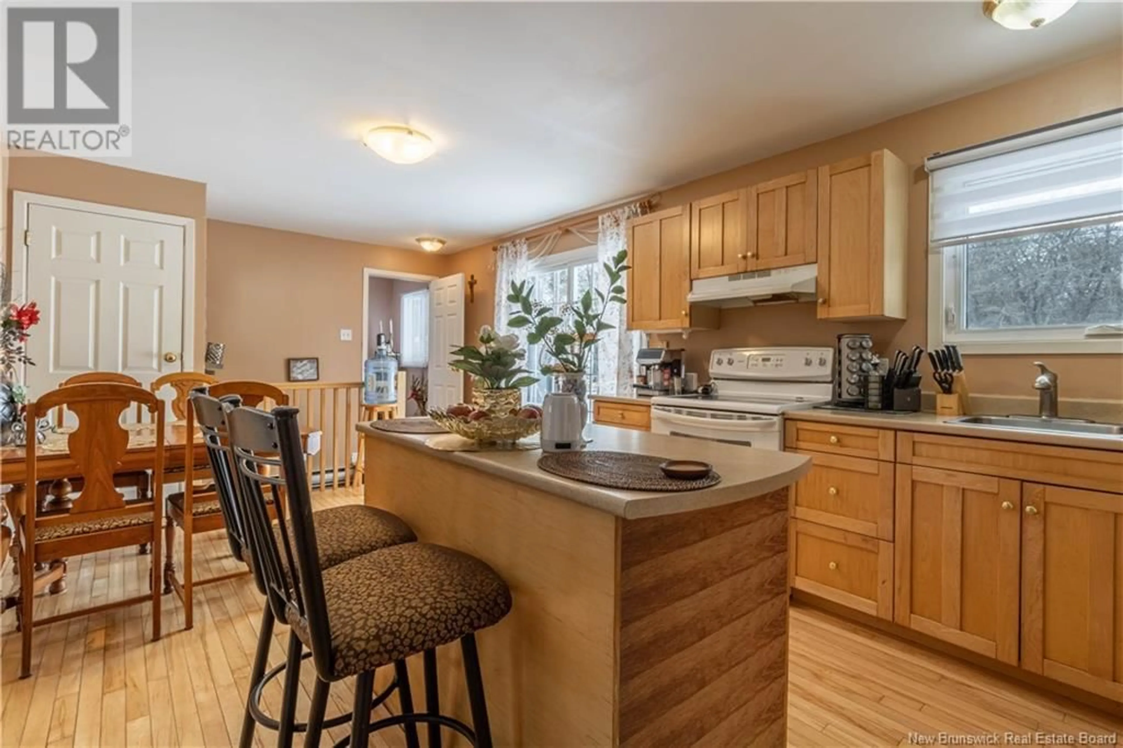 Open concept kitchen, wood/laminate floor for 49 TAVENER ROAD, Picadilly New Brunswick E4E5K8