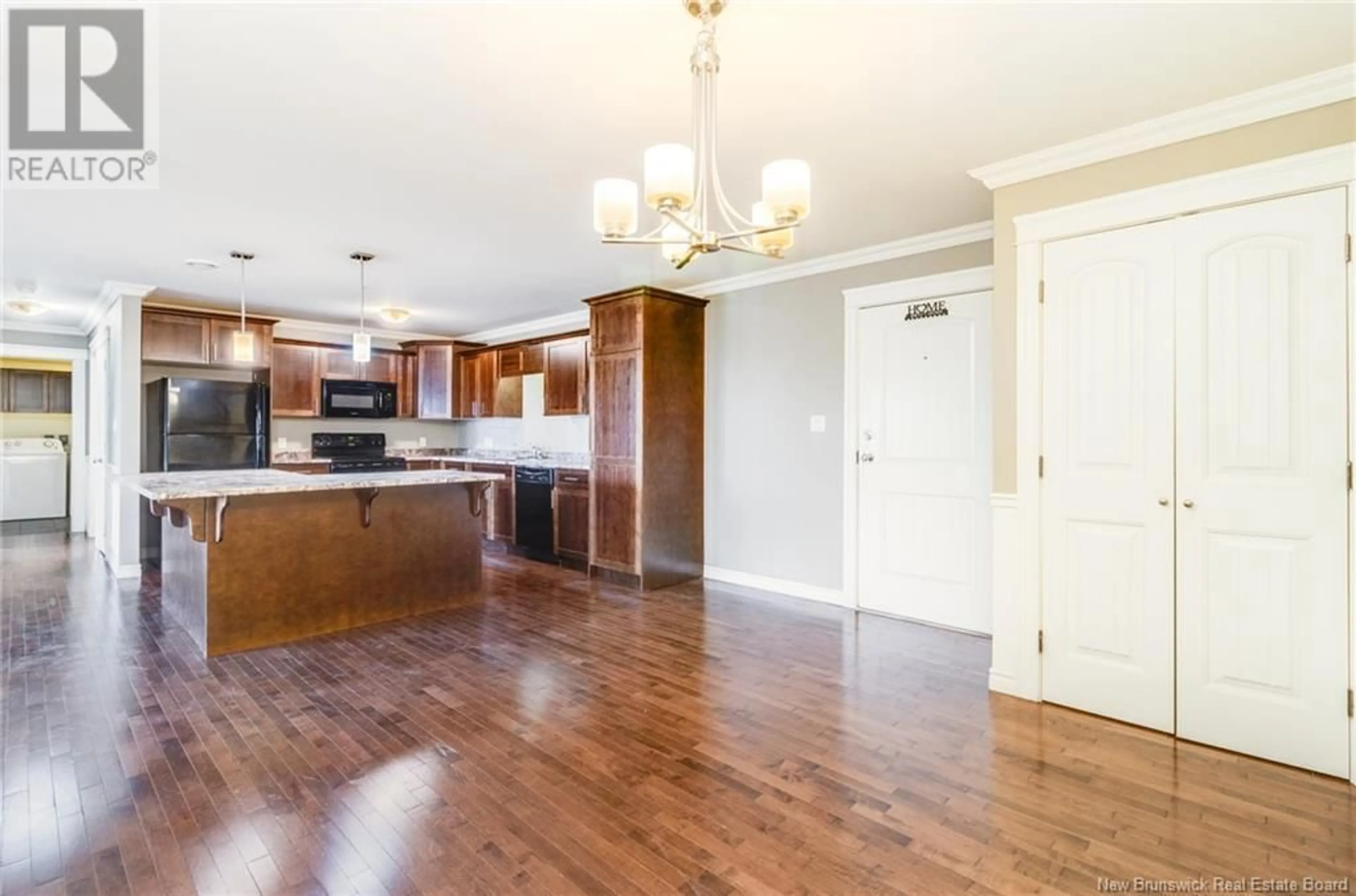 Open concept kitchen, wood/laminate floor for 323 - 155 LIAN STREET, Fredericton New Brunswick E3C0L9