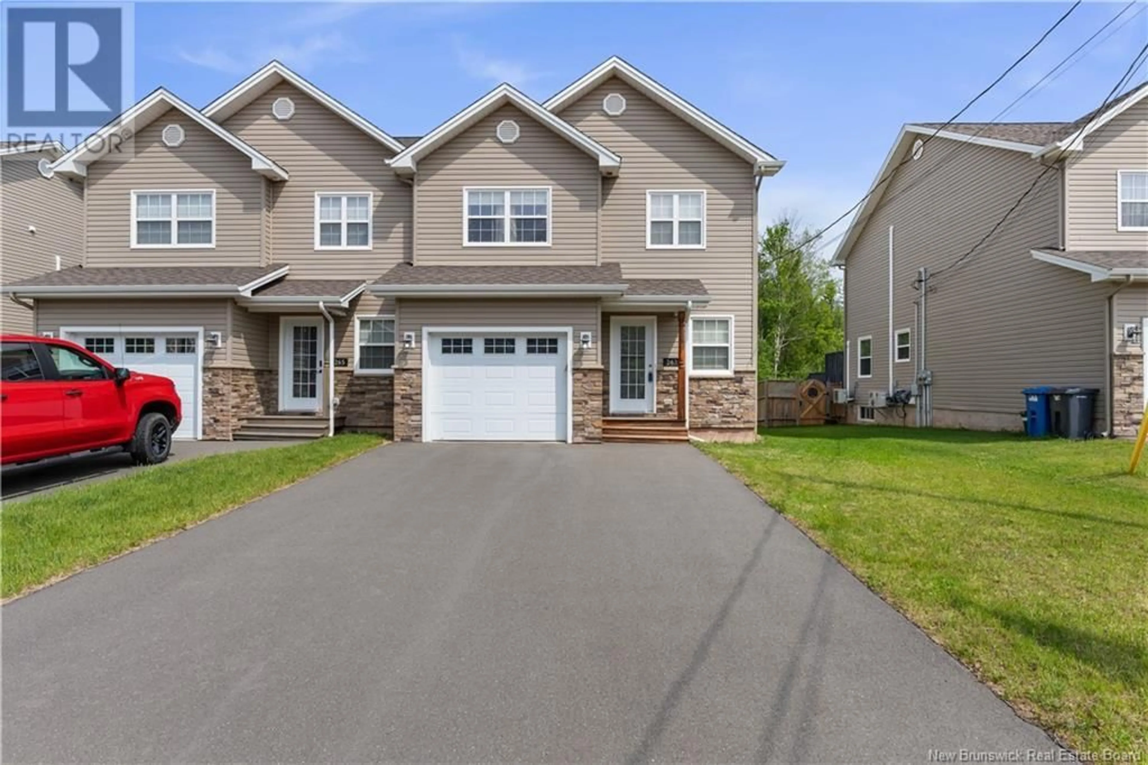 Home with vinyl exterior material, street for 263 DOLBEAU, Dieppe New Brunswick E1A9P9