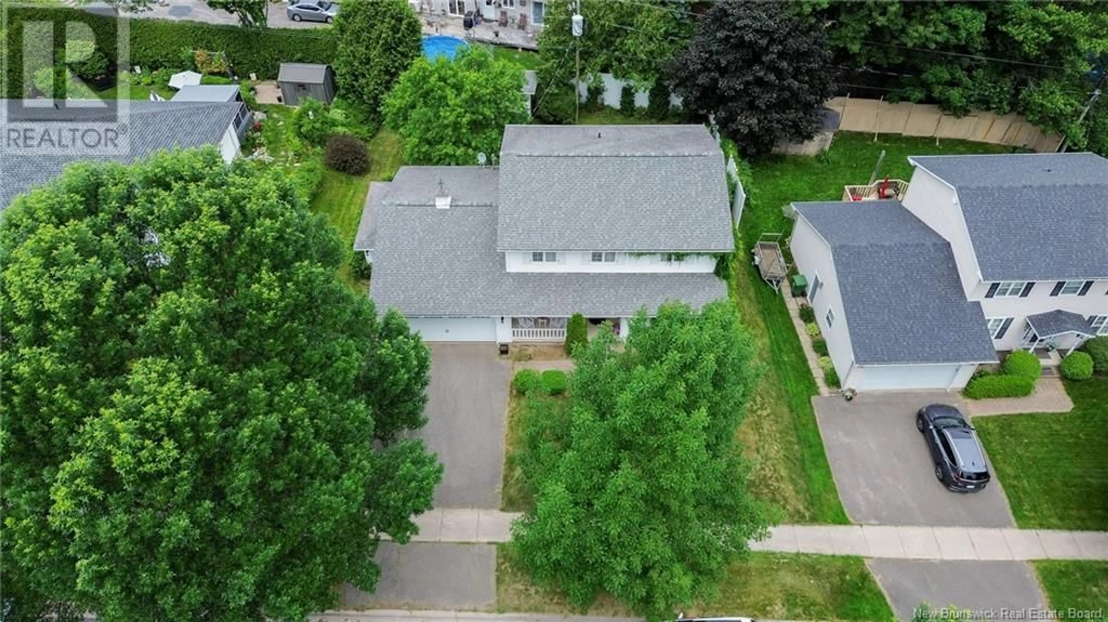 A pic from outside/outdoor area/front of a property/back of a property/a pic from drone, street for 53 BRENTWOOD DRIVE, Fredericton New Brunswick E3B7A5