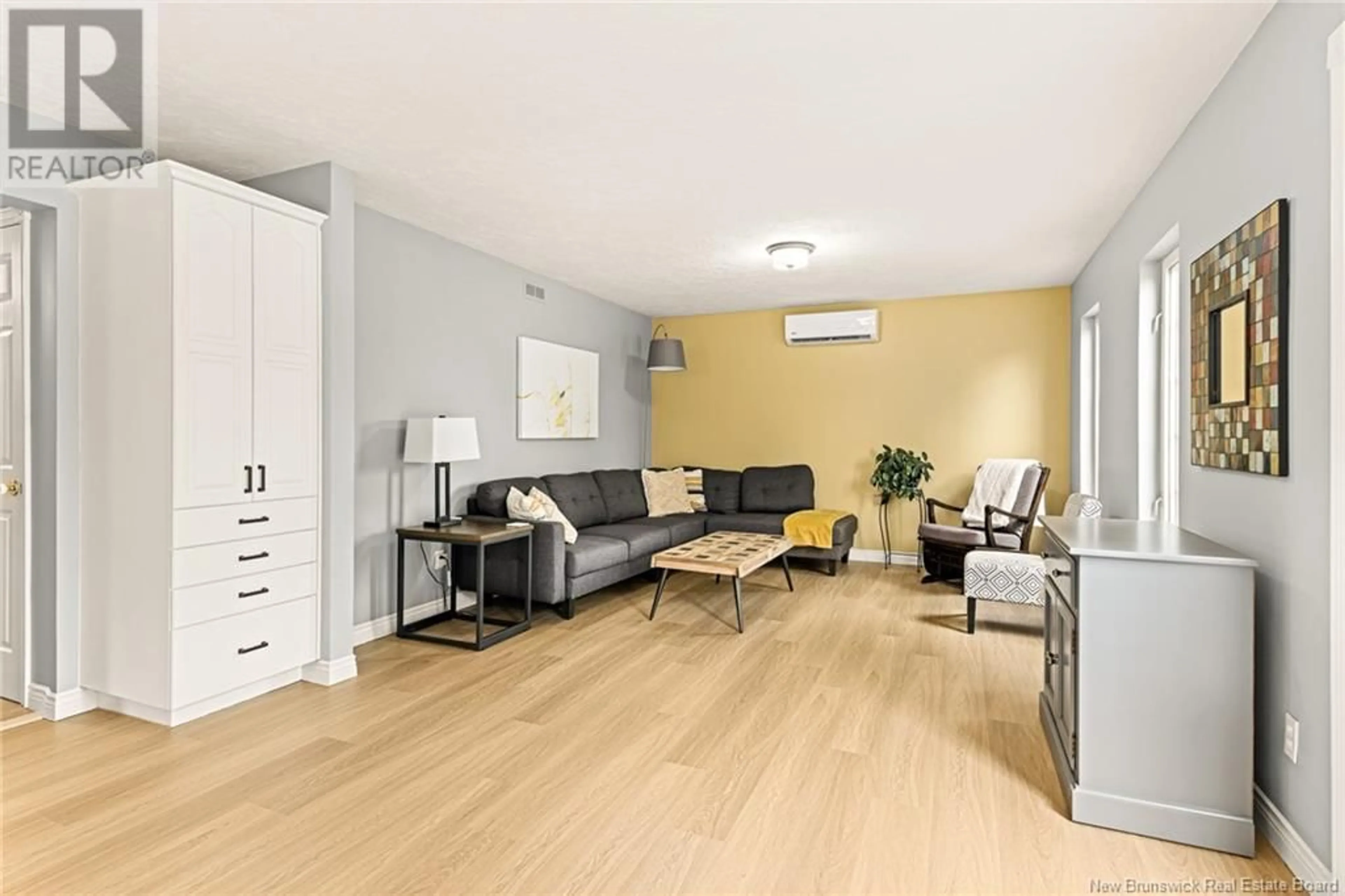 Living room with furniture, wood/laminate floor for 85 CASTLE DRIVE, Moncton New Brunswick E1A6M2