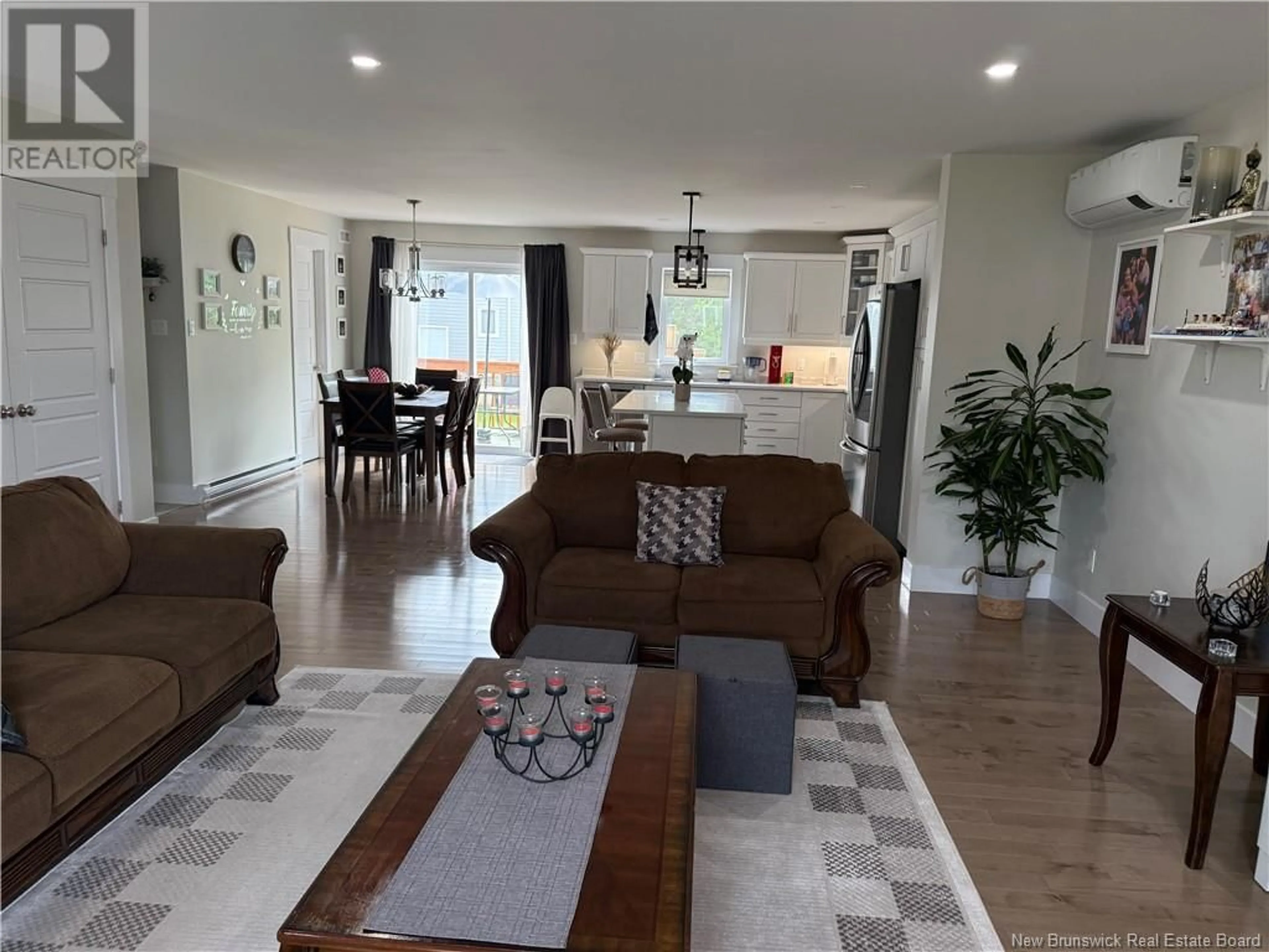 Living room with furniture, wood/laminate floor for 92 SATARA DRIVE, Moncton New Brunswick E1G6G3