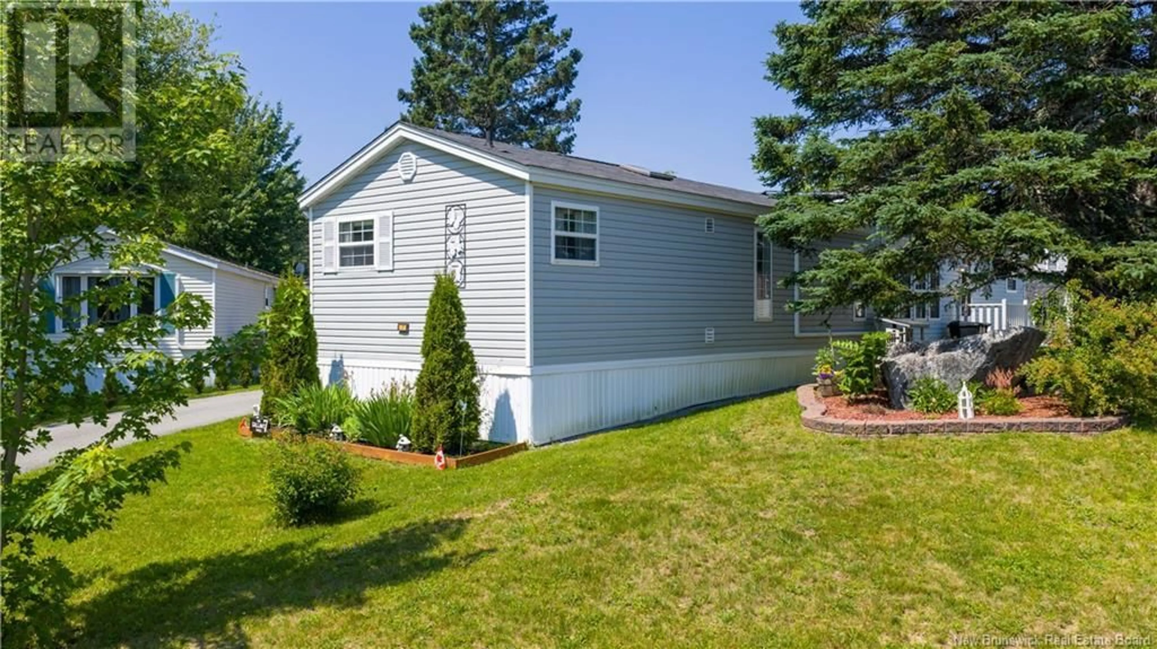 Home with vinyl exterior material, street for 7 SITKA LANE, Quispamsis New Brunswick E2G1W9