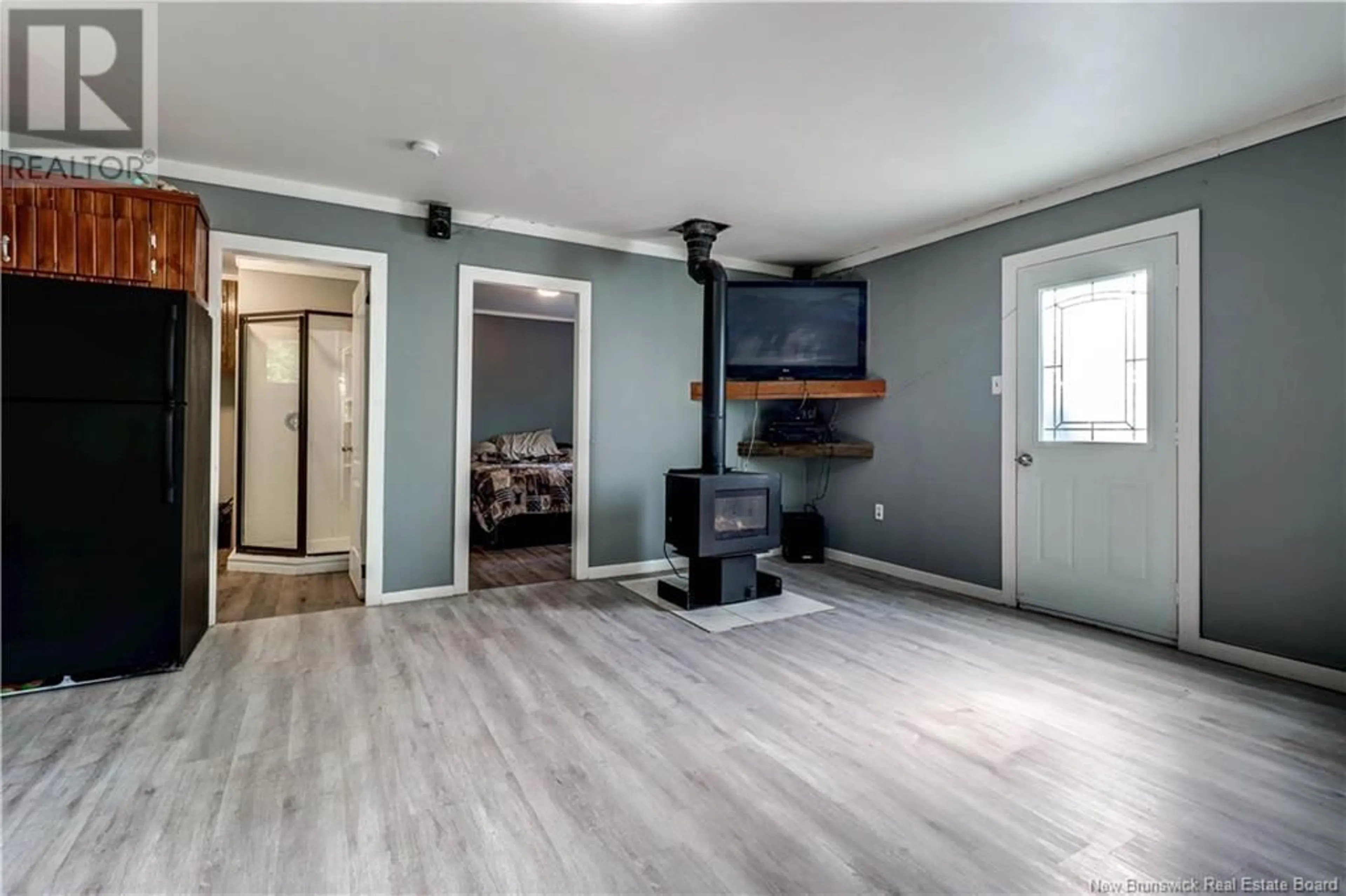 Living room with furniture, wood/laminate floor for 5342 ROUTE 105, Whites Cove New Brunswick E4C3H6