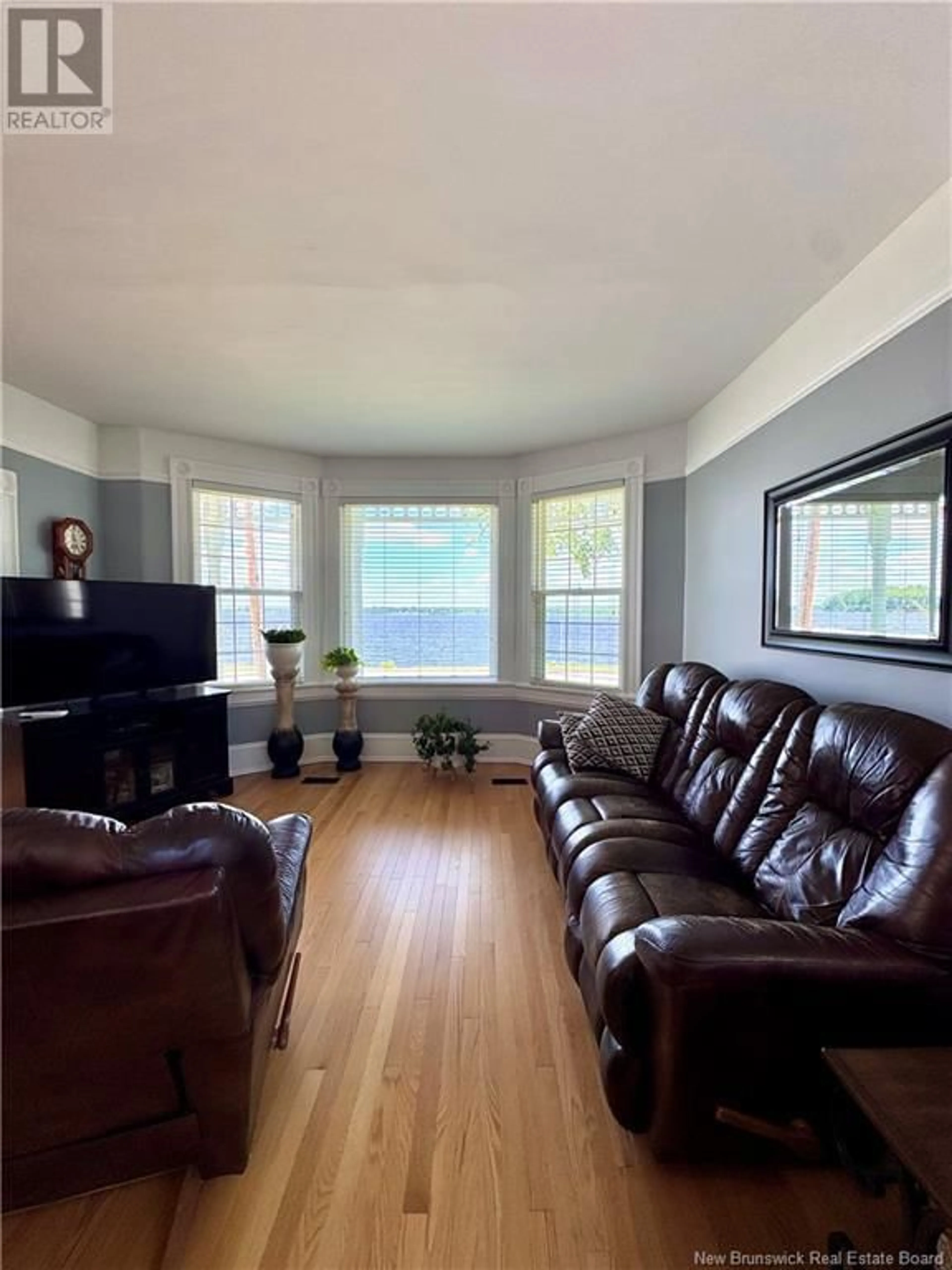 Living room with furniture, wood/laminate floor for 2 SUTTON ROAD, Miramichi New Brunswick E1N5V7