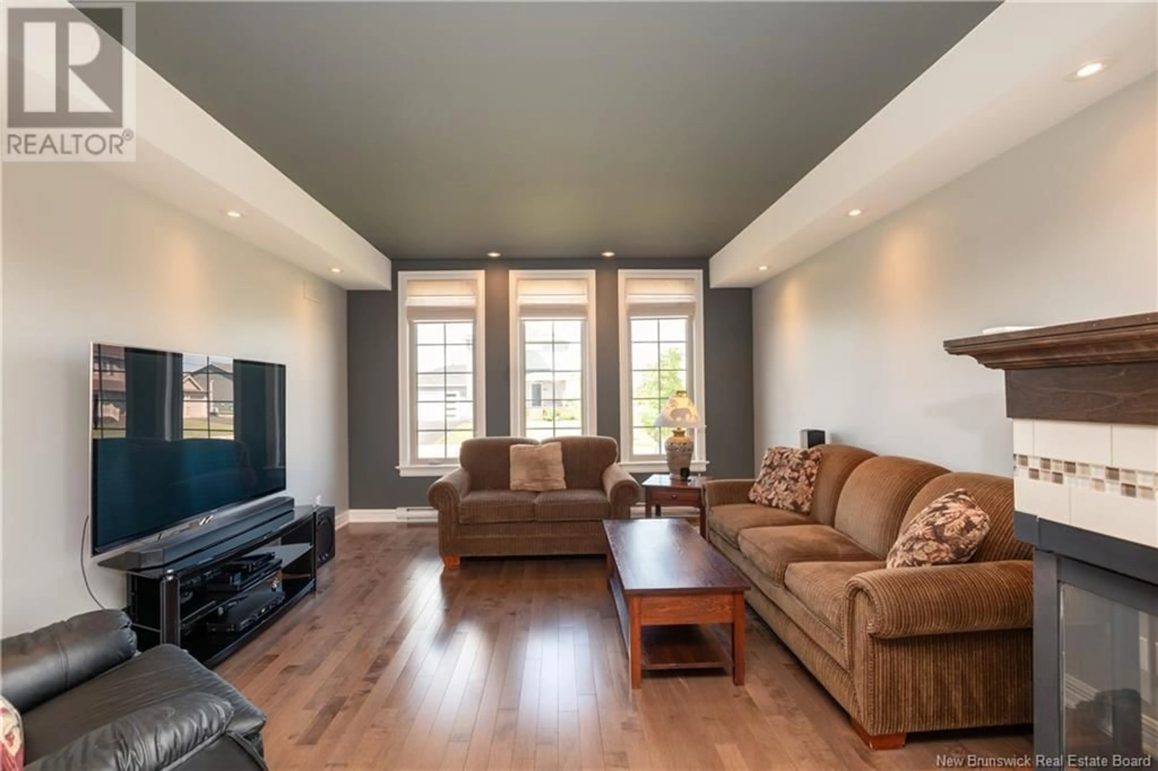 Living room with furniture, wood/laminate floor for 144 OAKFIELD DRIVE, Riverview New Brunswick E1B0S6