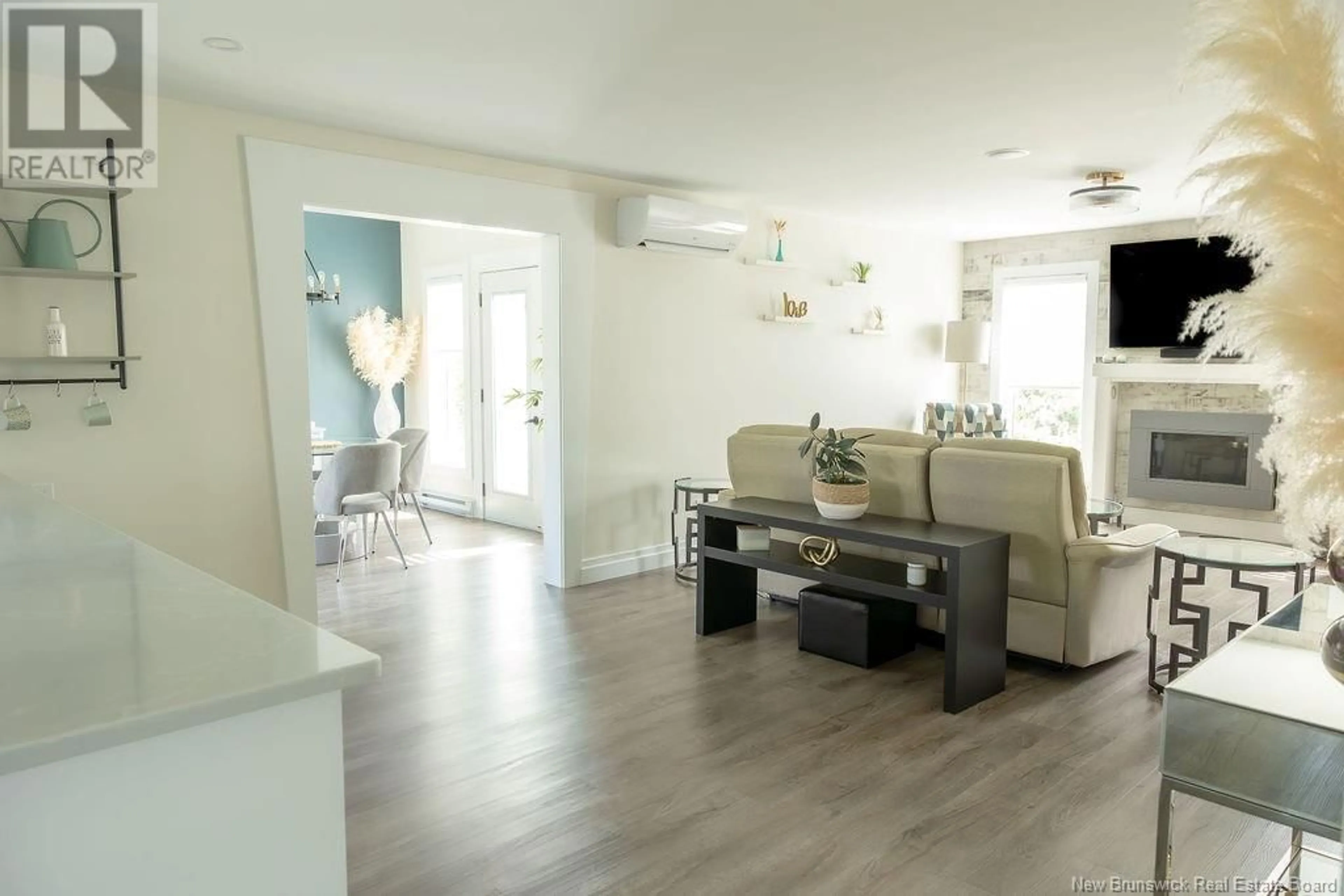 Living room with furniture, wood/laminate floor for 32 NORTHUMBERLAND STREET, Moncton New Brunswick E1A6S8