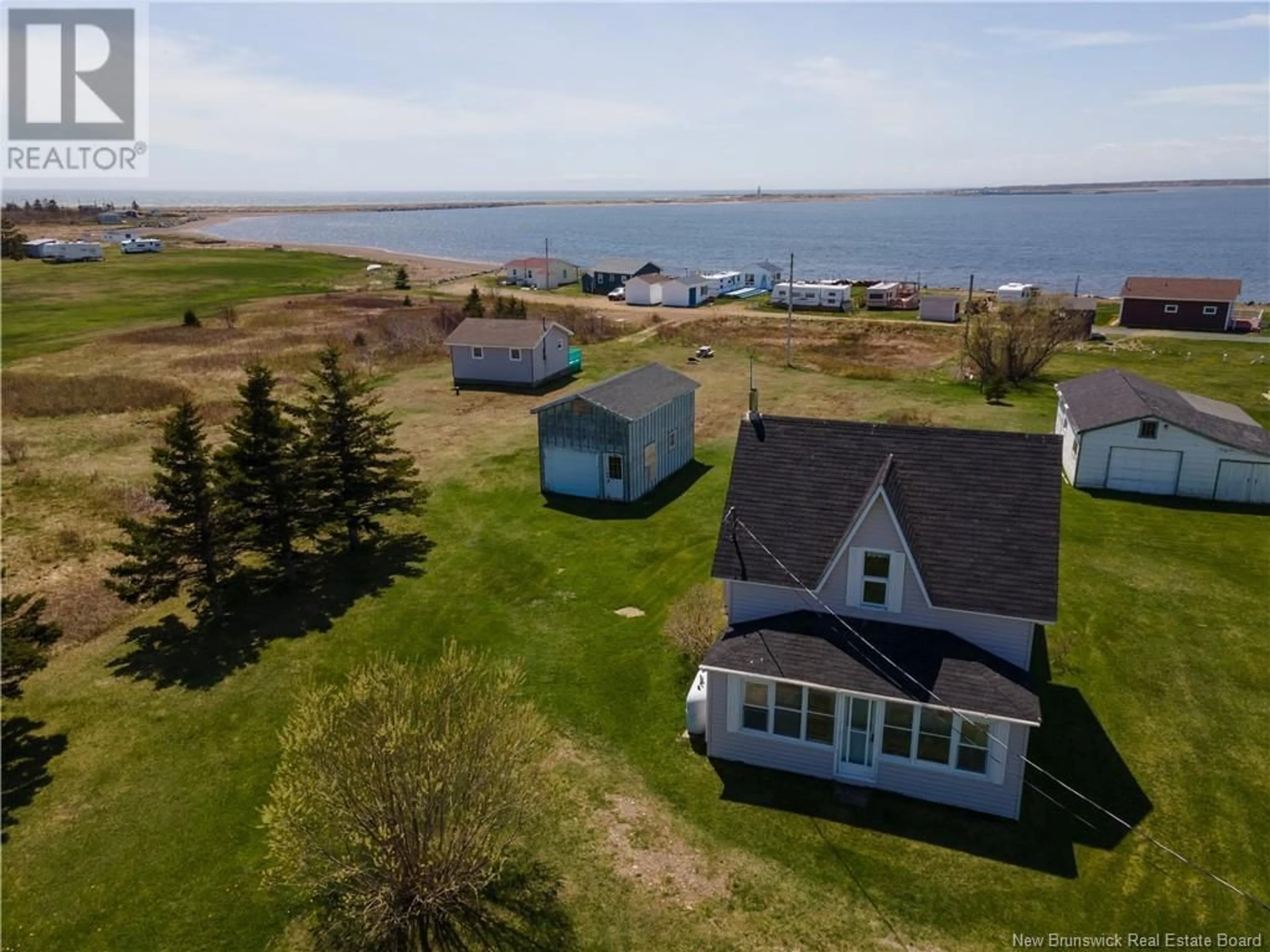 A pic from outside/outdoor area/front of a property/back of a property/a pic from drone, water/lake/river/ocean view for 15 DES HIRONDELLES, Chiasson Office New Brunswick E8S2N4