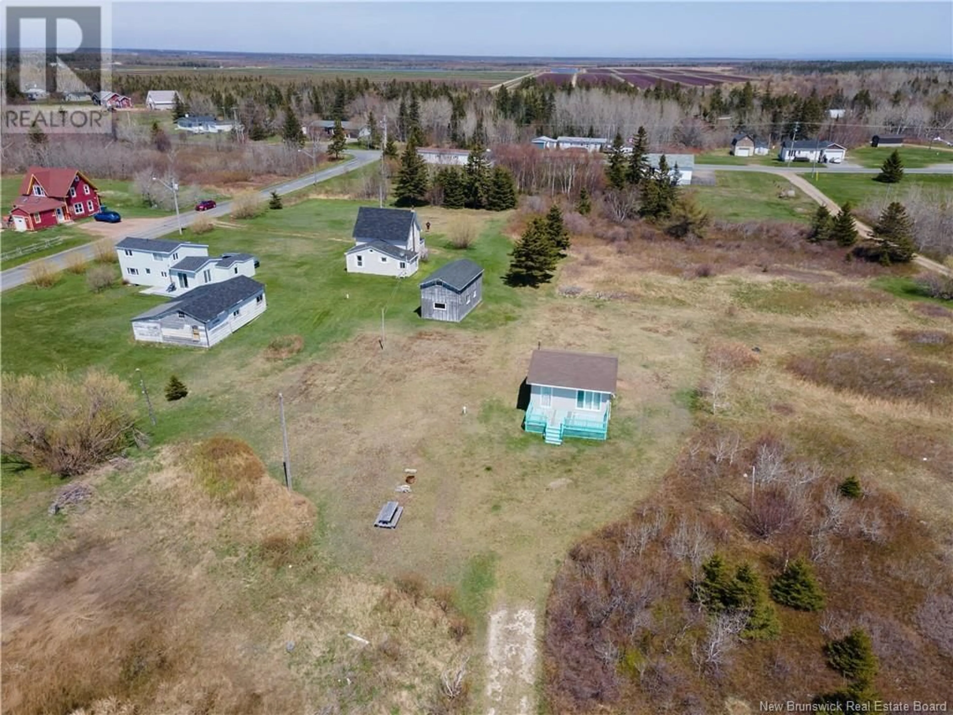 A pic from outside/outdoor area/front of a property/back of a property/a pic from drone, unknown for 15 DES HIRONDELLES, Chiasson Office New Brunswick E8S2N4