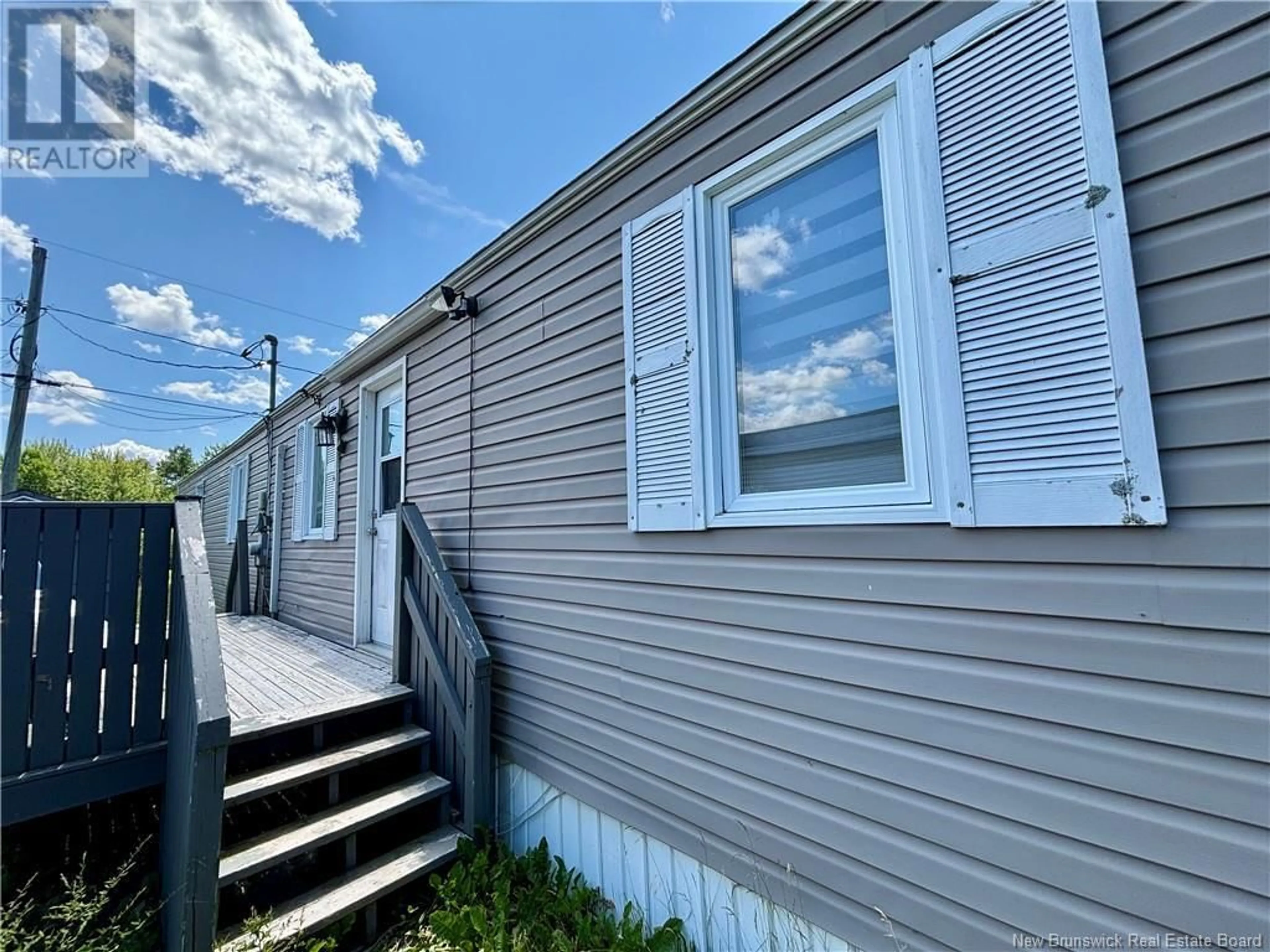 Home with vinyl exterior material, street for 58 ROUTE 102, Burton New Brunswick E2V2Y8