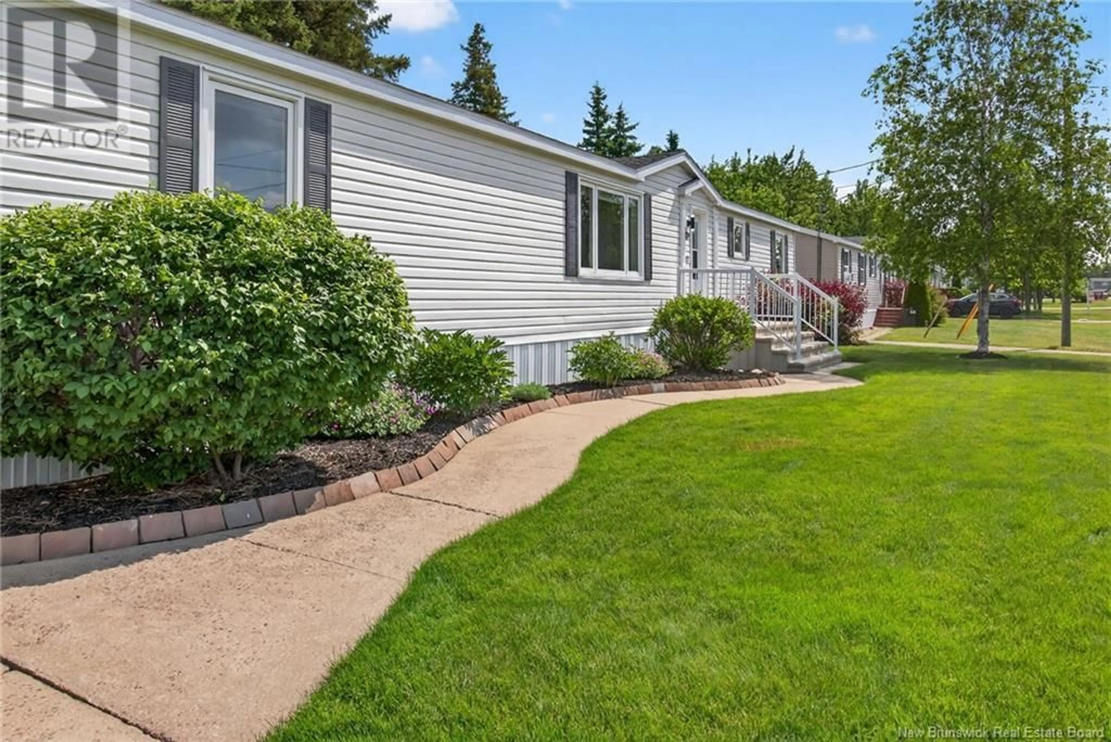 Home with vinyl exterior material, street for 148 NEPISIGUIT DRIVE, Dieppe New Brunswick E1A7N1