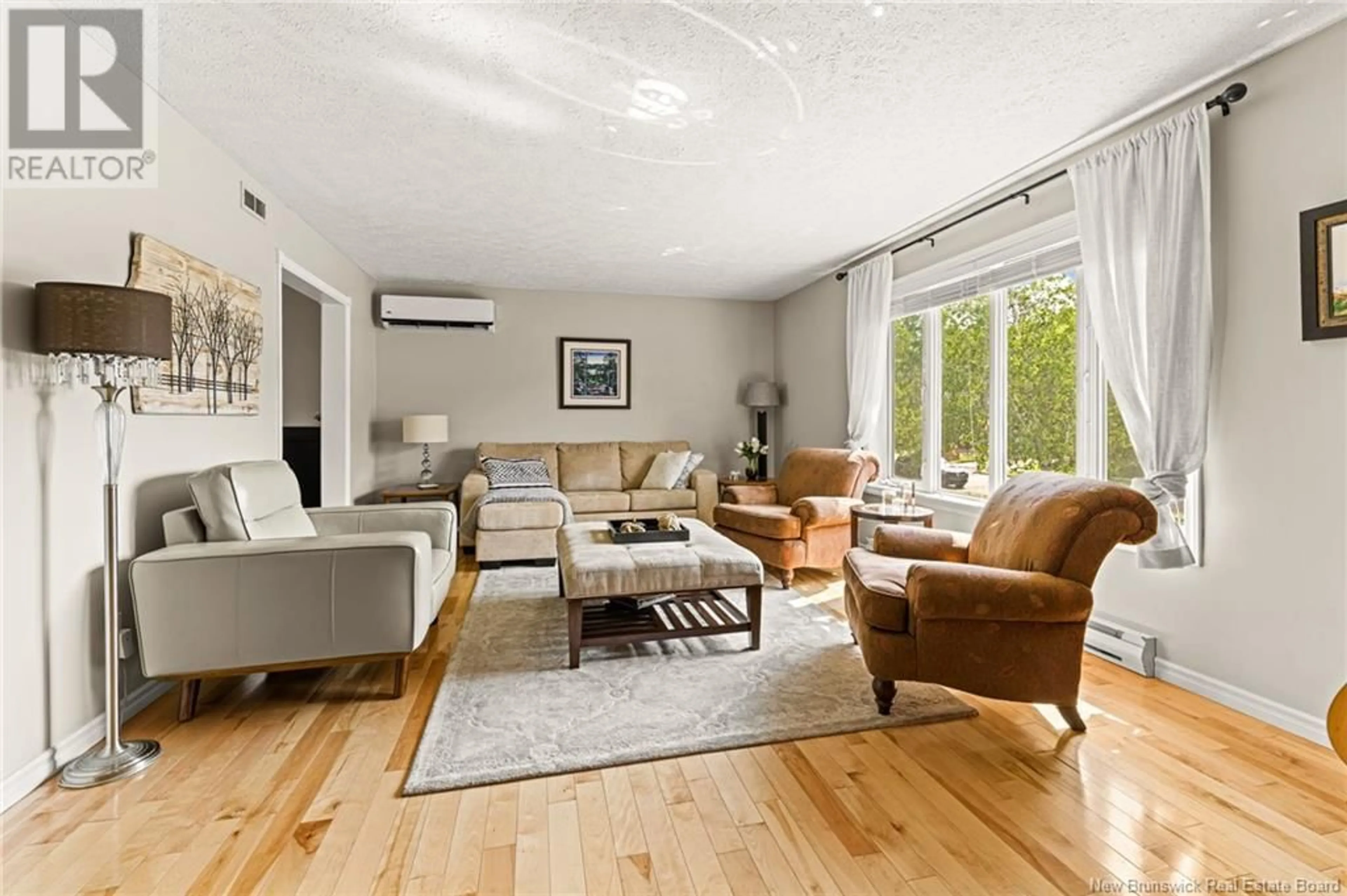 Living room with furniture, unknown for 143 WHITE OAK TERRACE, Moncton New Brunswick E1G2E5