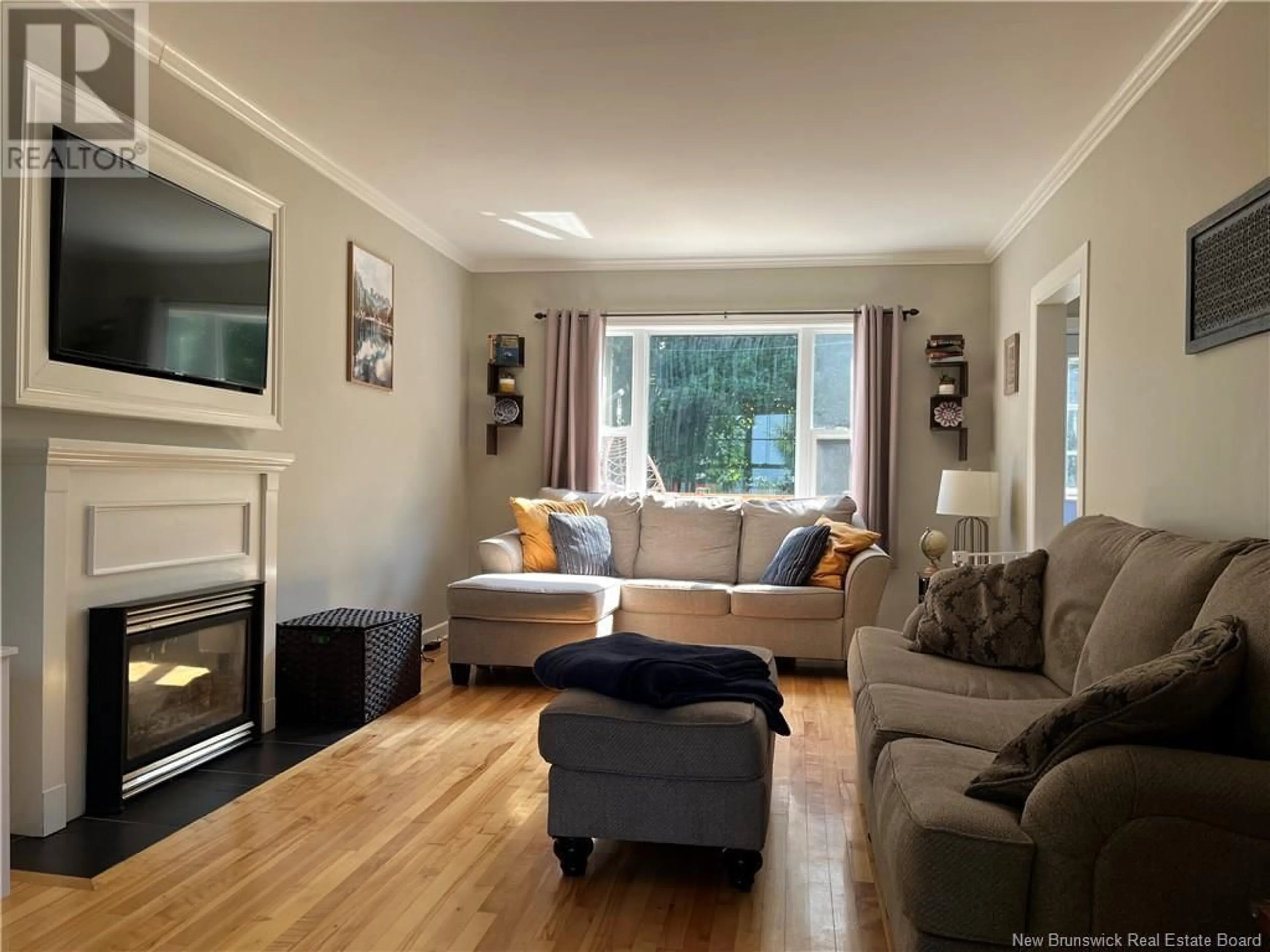 Living room with furniture, wood/laminate floor for 120 HILLCREST DRIVE, Saint John New Brunswick E2M4C3